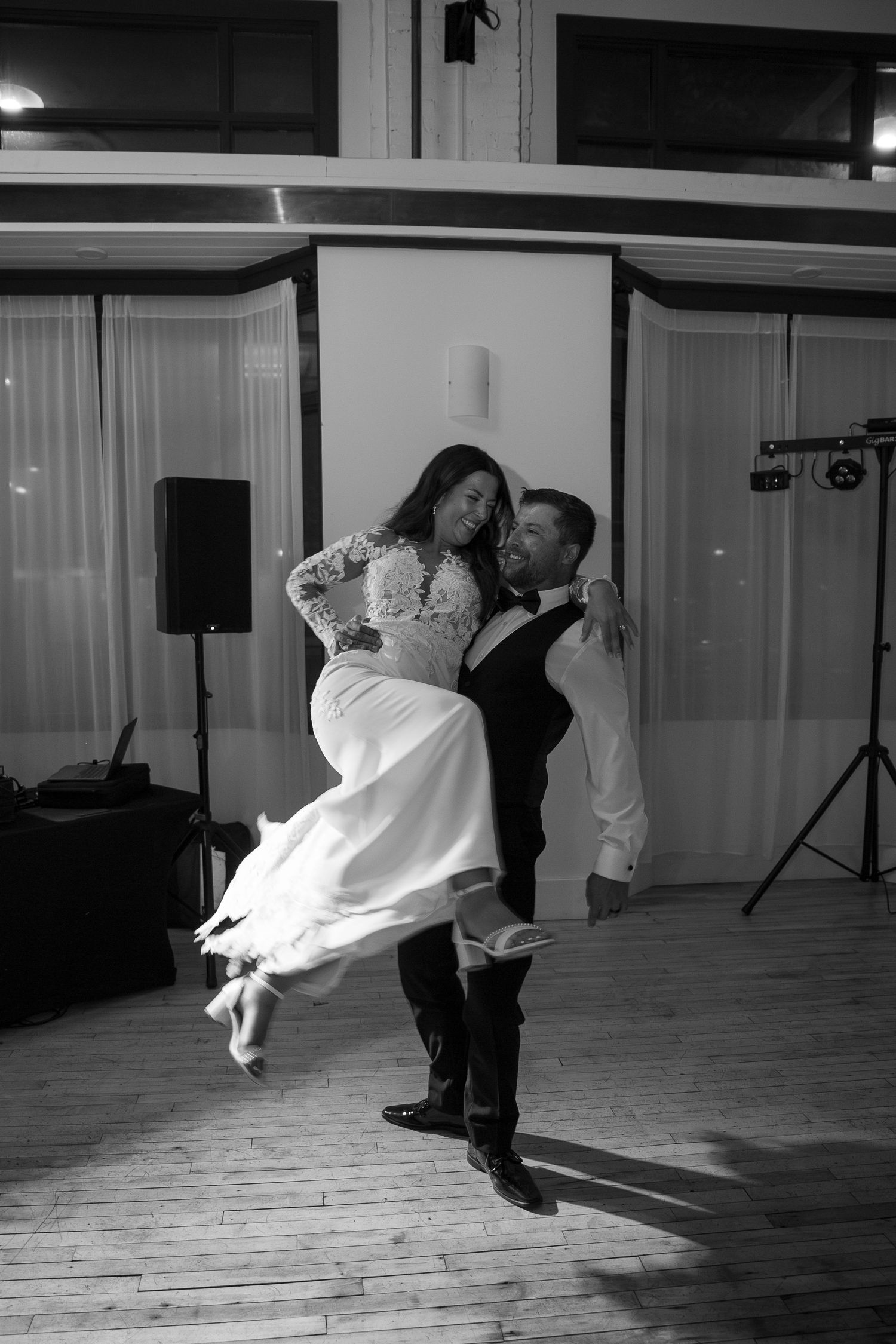 A romantic dance sequence showing a couple performing a dramatic dip on a wooden dance floor at the Avenue Room in Saskatoon, Saskatchewan.