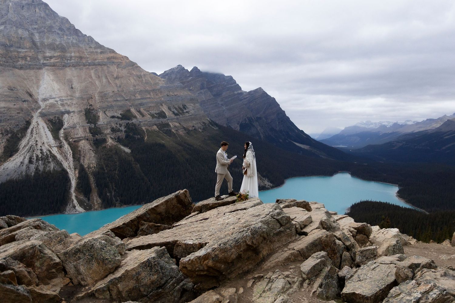 Dramatic mountain landscape with turquoise alpine lakes surrounded by rocky peaks and cliffs at Banff National Park on the Canadian Rockies.