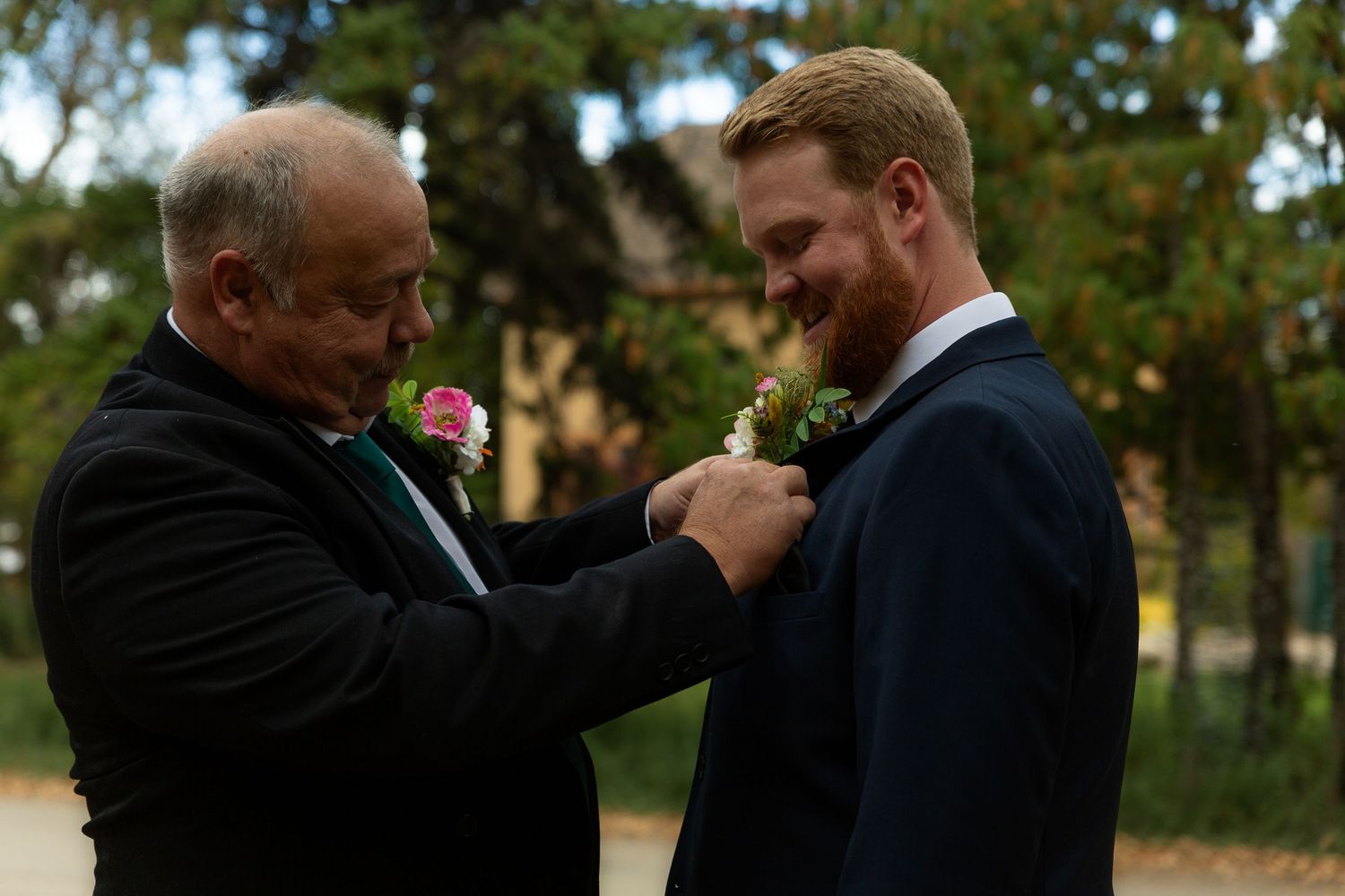 Emotional wedding ceremony moment captured in outdoor garden setting.