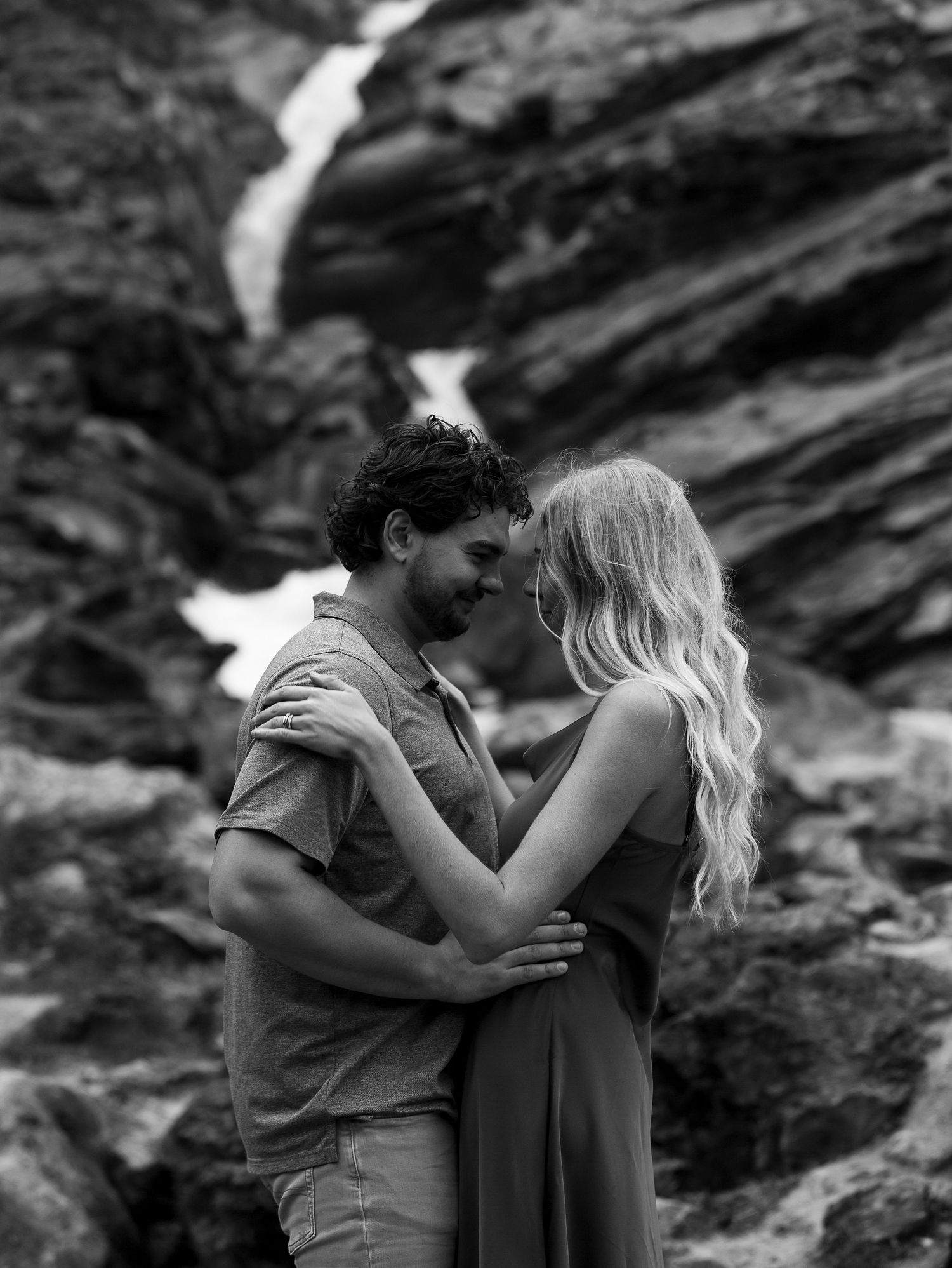 A romantic black and white photoshoot on rocky coastal cliffs at Banff National Park on the Canadian Rockies.