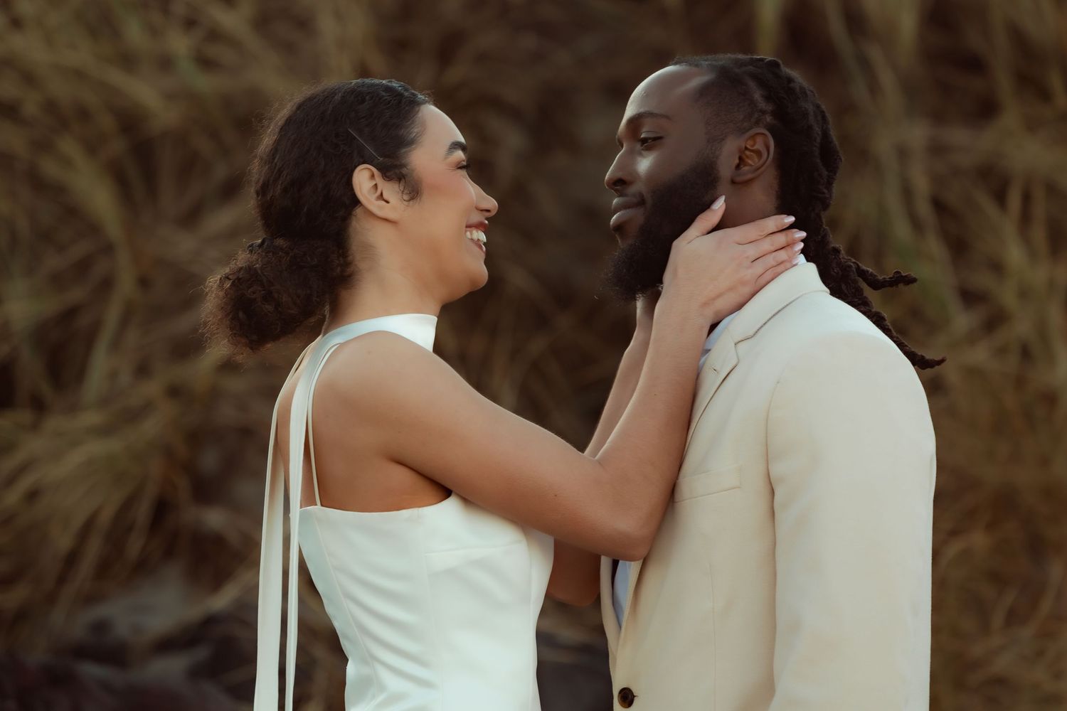 A romantic couple in white attire shares tender moments in a series of intimate outdoor photos at sunset.