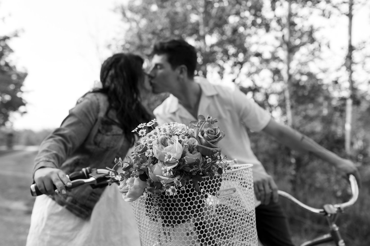 Couple enjoying tender moment together during outdoor photo session.