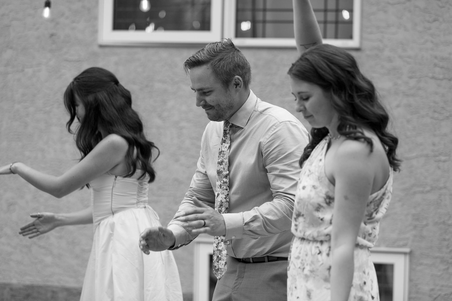 Wedding guests enjoying a casual outdoor celebration.
