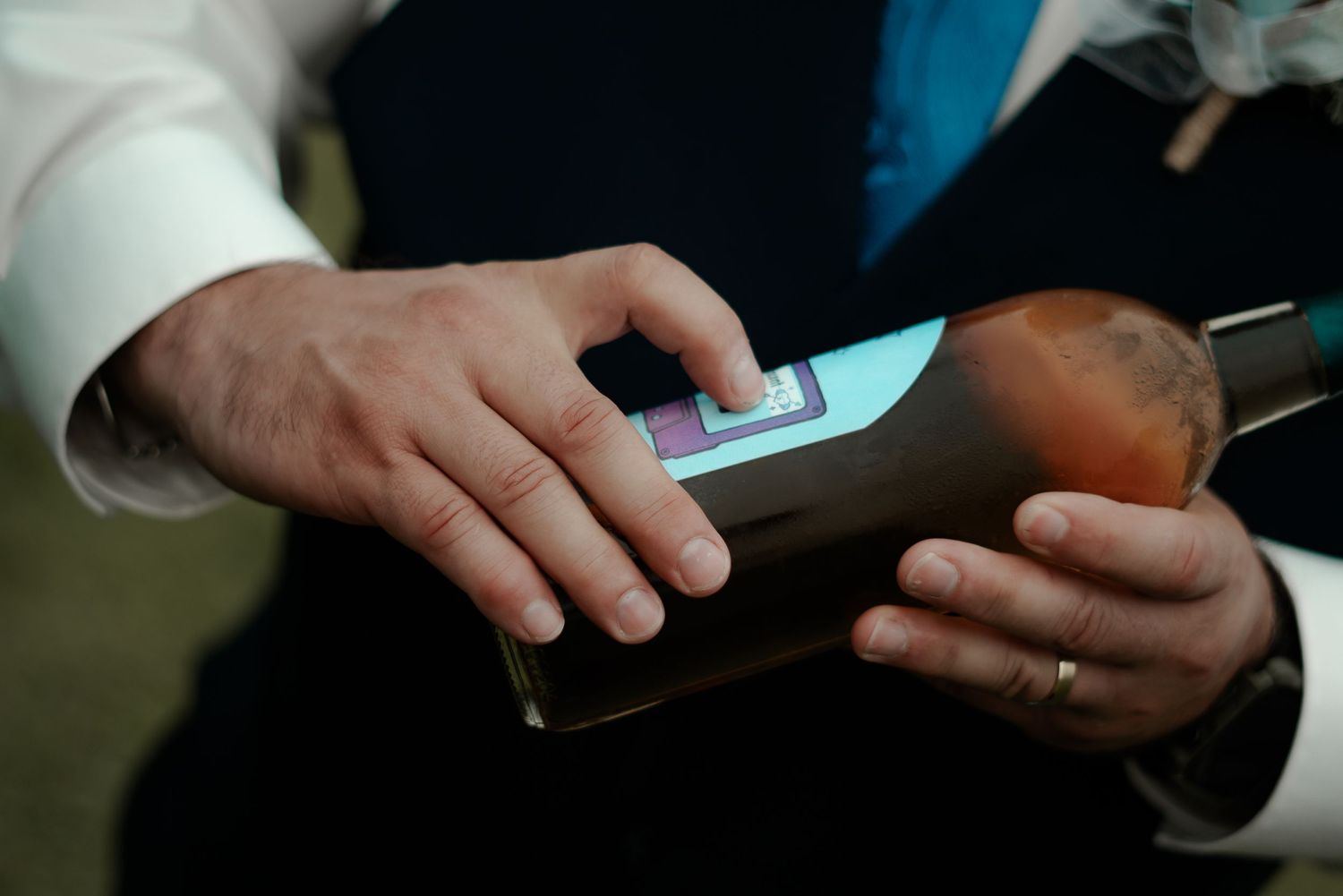 Close-up of hands holding a leather wallet showing a credit card transaction.