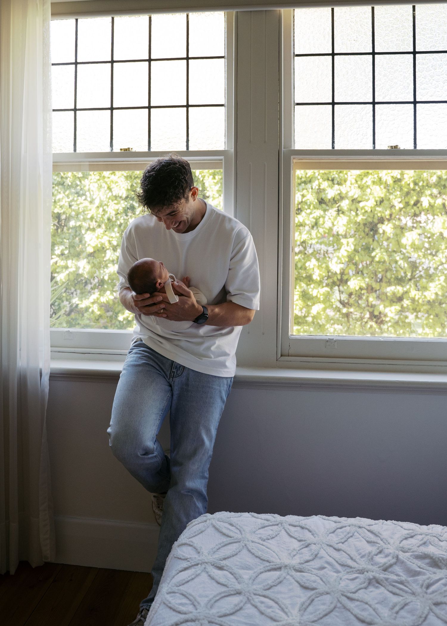 A newborn photography session at a family home with their 2 week old baby boy.