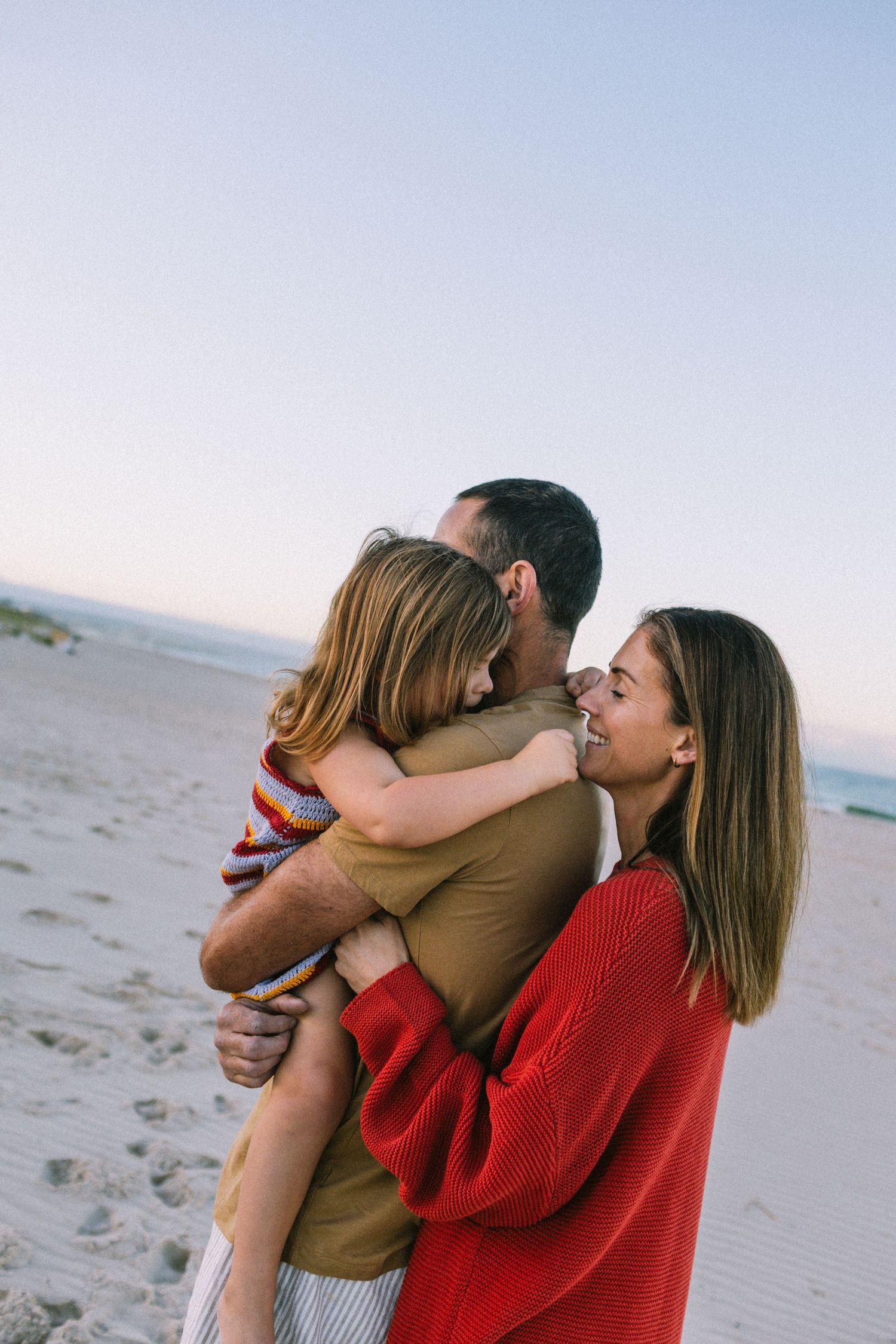 About Justine Edwards. A family photography session at the beach at sunrise with their 4 children.