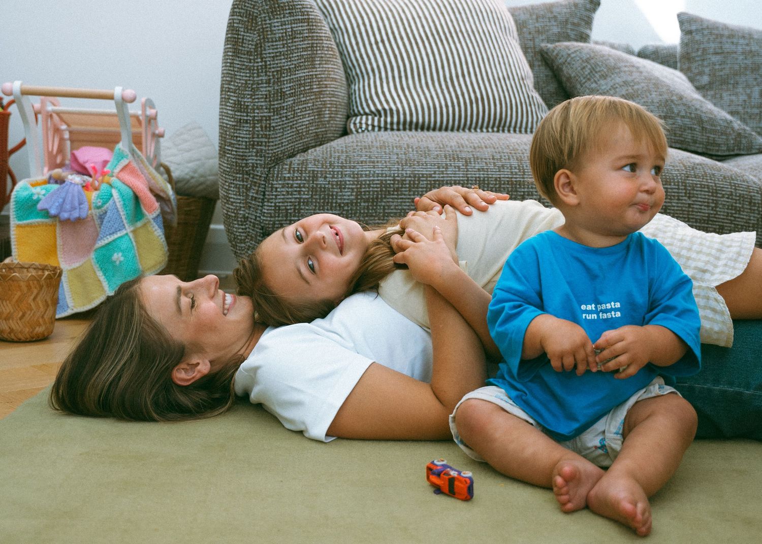 A bright and colourful family photoshoot at home in Adelaide. Full of chaos and fun.