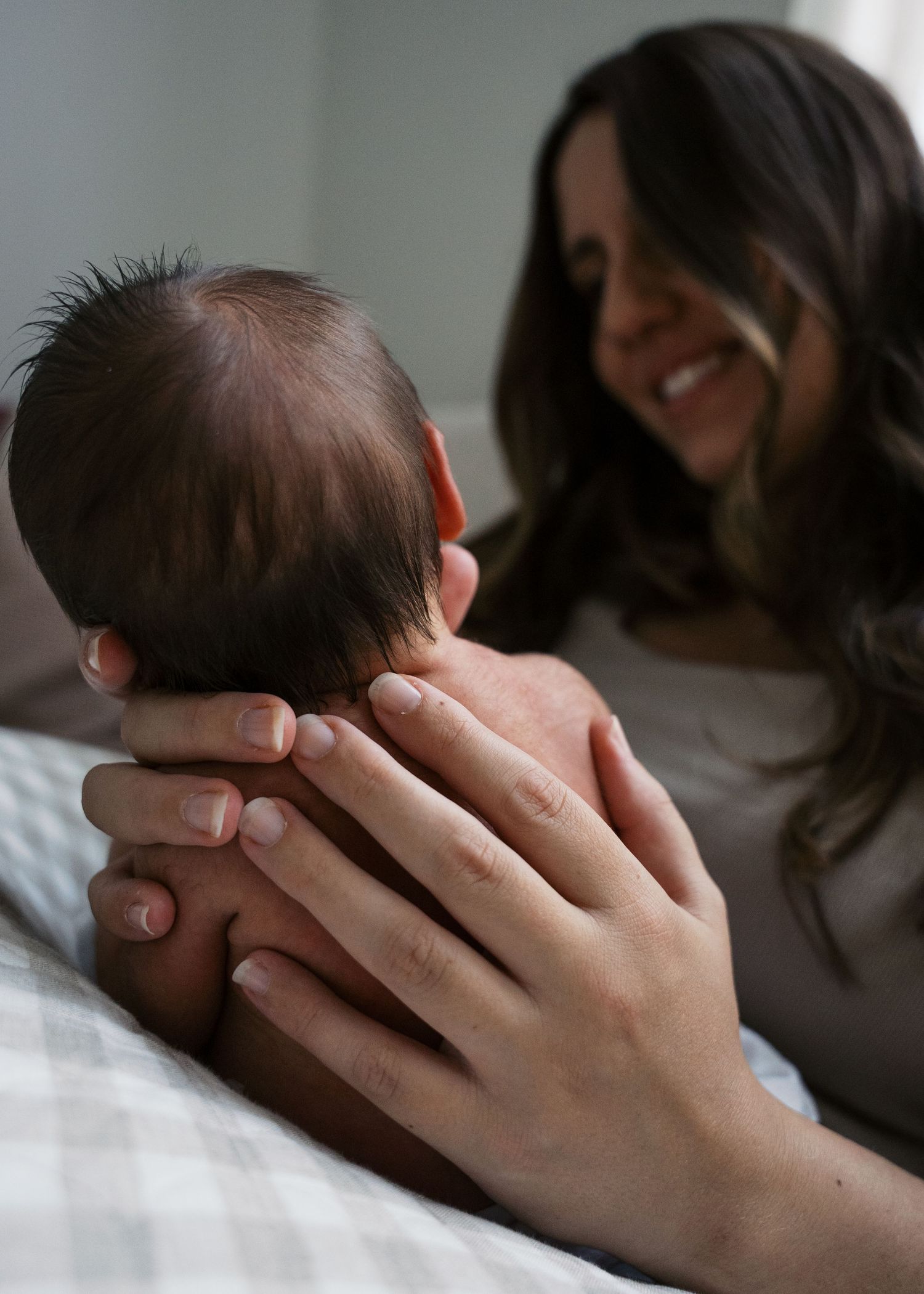 A newborn photography session at a family home with their 2 week old baby boy.