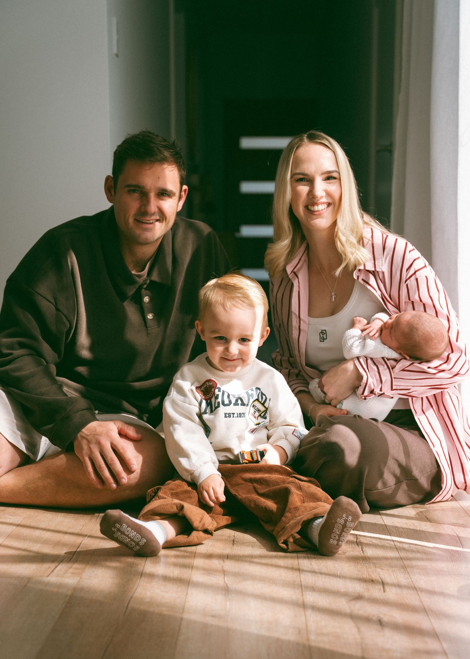 A newborn photography session at a family home with their 2 week old baby girl and toddler.