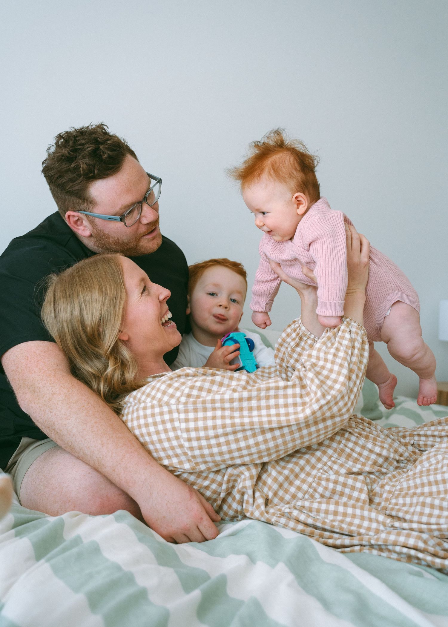 A family photography session at home with two young children.