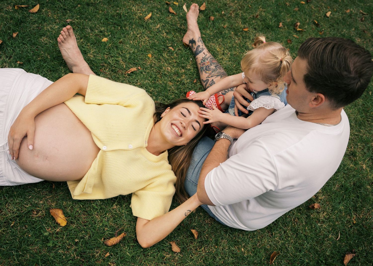 A maternity family photography session in the hills at sunset.