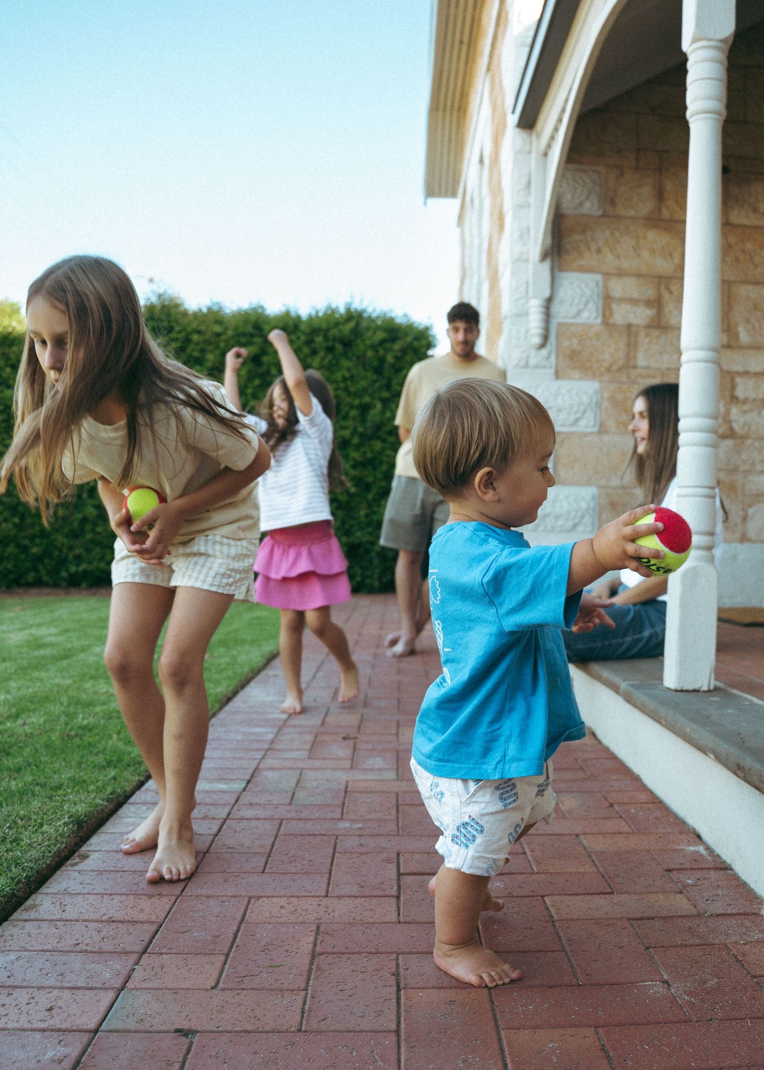 A bright and colourful family photoshoot at home in Adelaide. Full of chaos and fun.