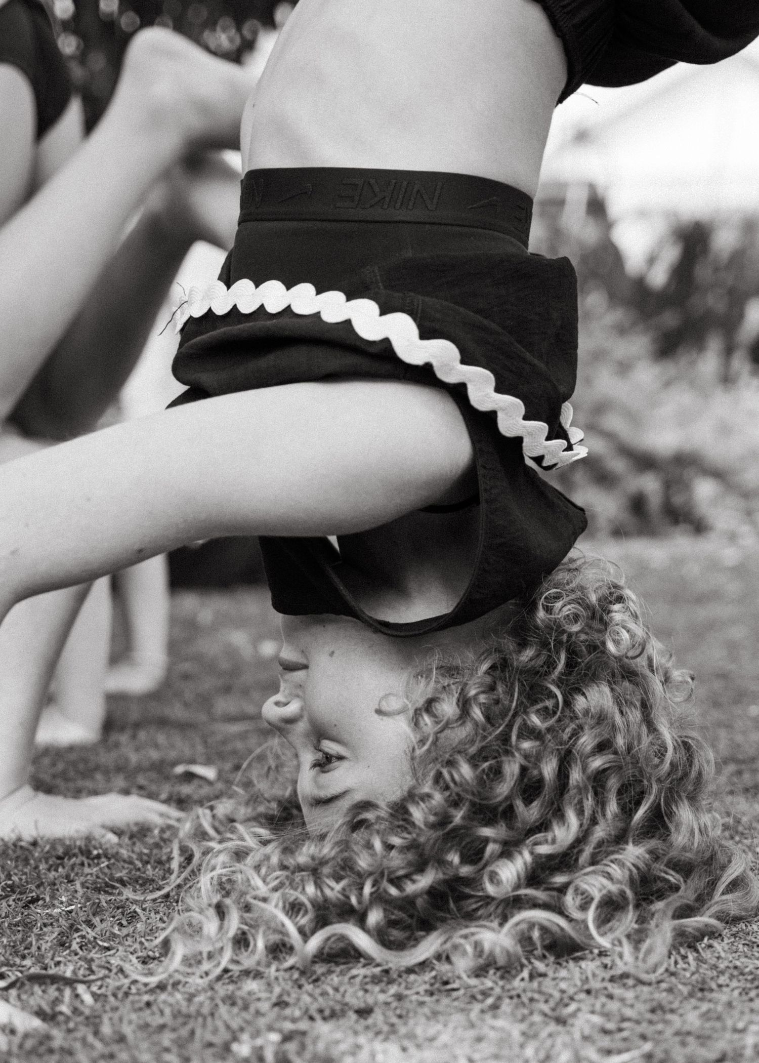 An extended family photoshoot at their family home with the children and grandchildren laughing and having fun together.