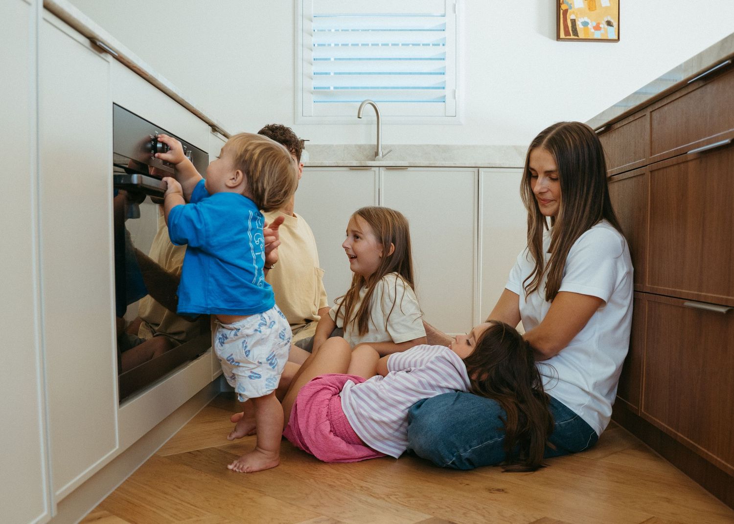 A bright and colourful family photoshoot at home in Adelaide. Full of chaos and fun.