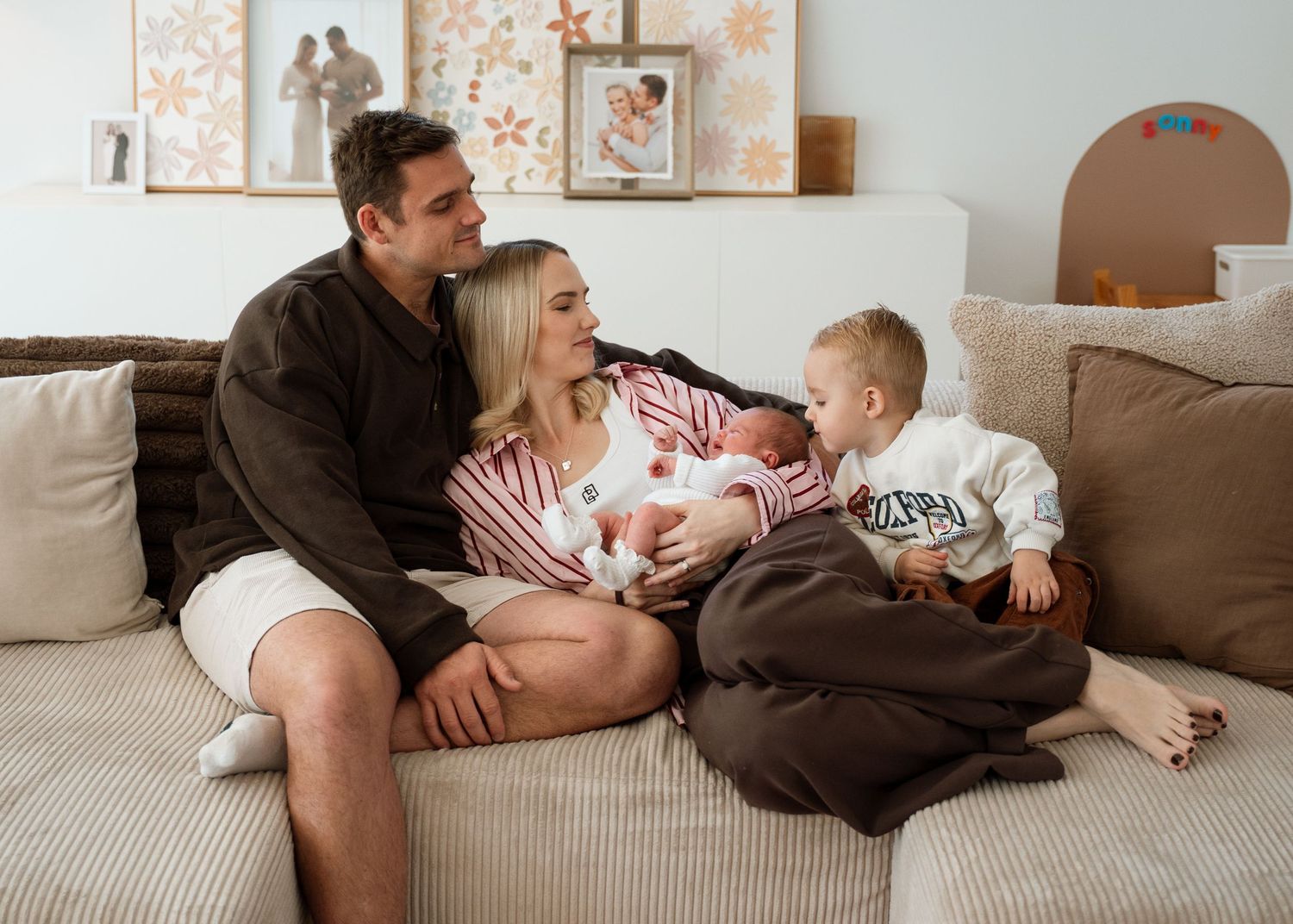 A newborn photography session at a family home with their 2 week old baby girl and toddler.