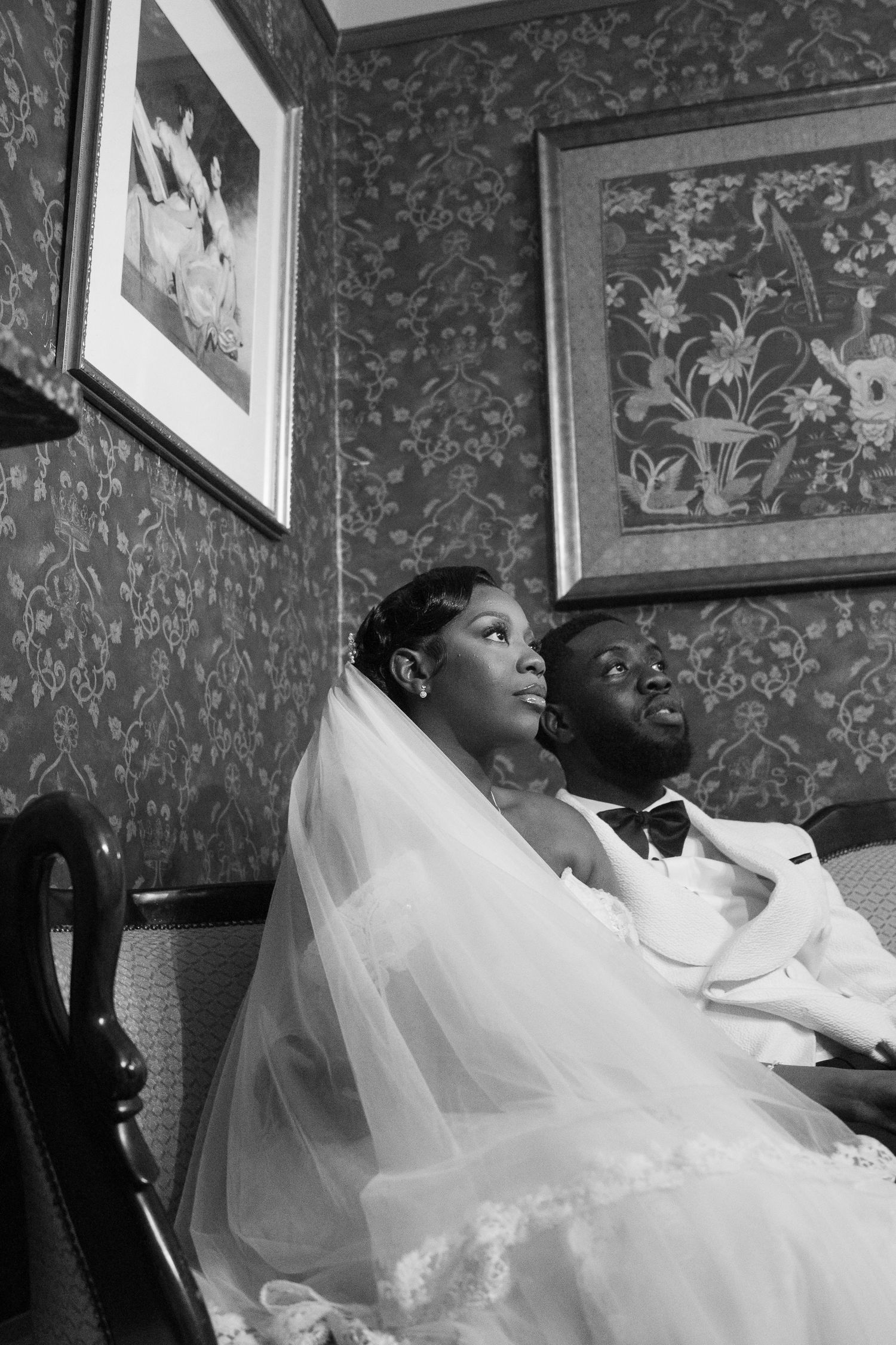 Black and white portrait series of bride relaxing in her wedding gown.