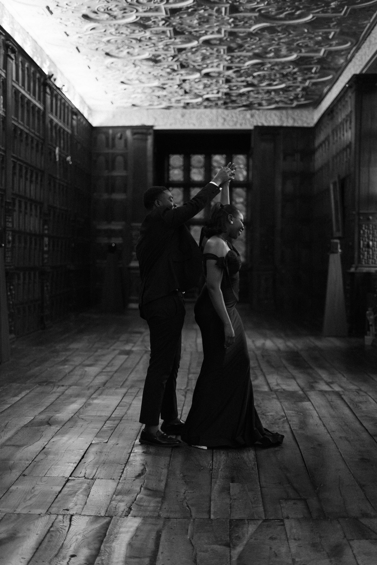 Black and white sequence of dancing silhouettes in a vintage industrial space.