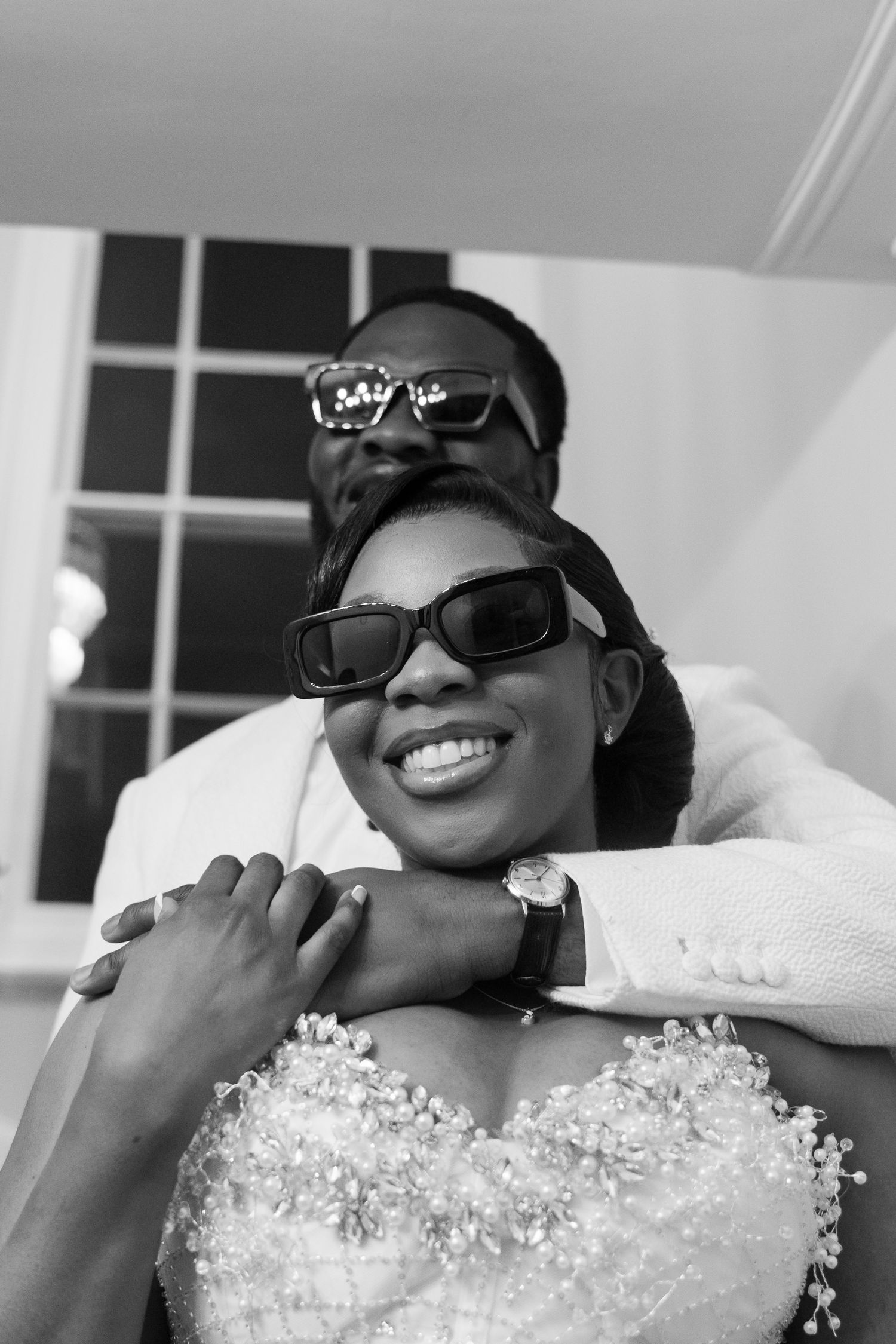 Close-up shots showing someone wearing sunglasses and sparkling formal attire.