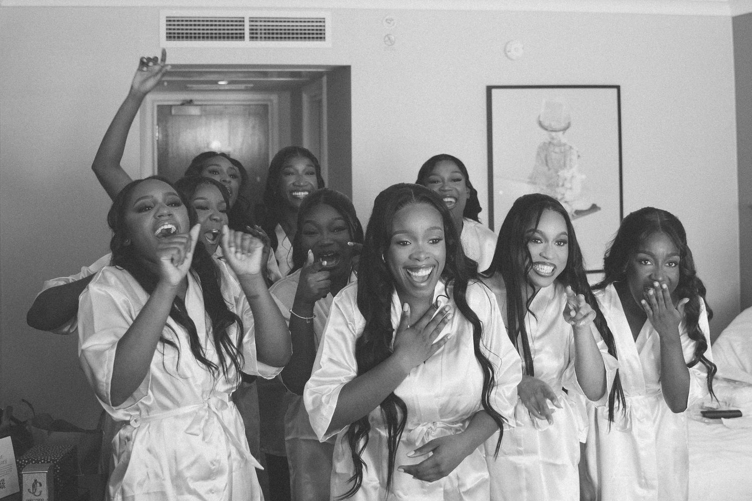 Wedding party celebrates in black and white candid shots showing pure joy.