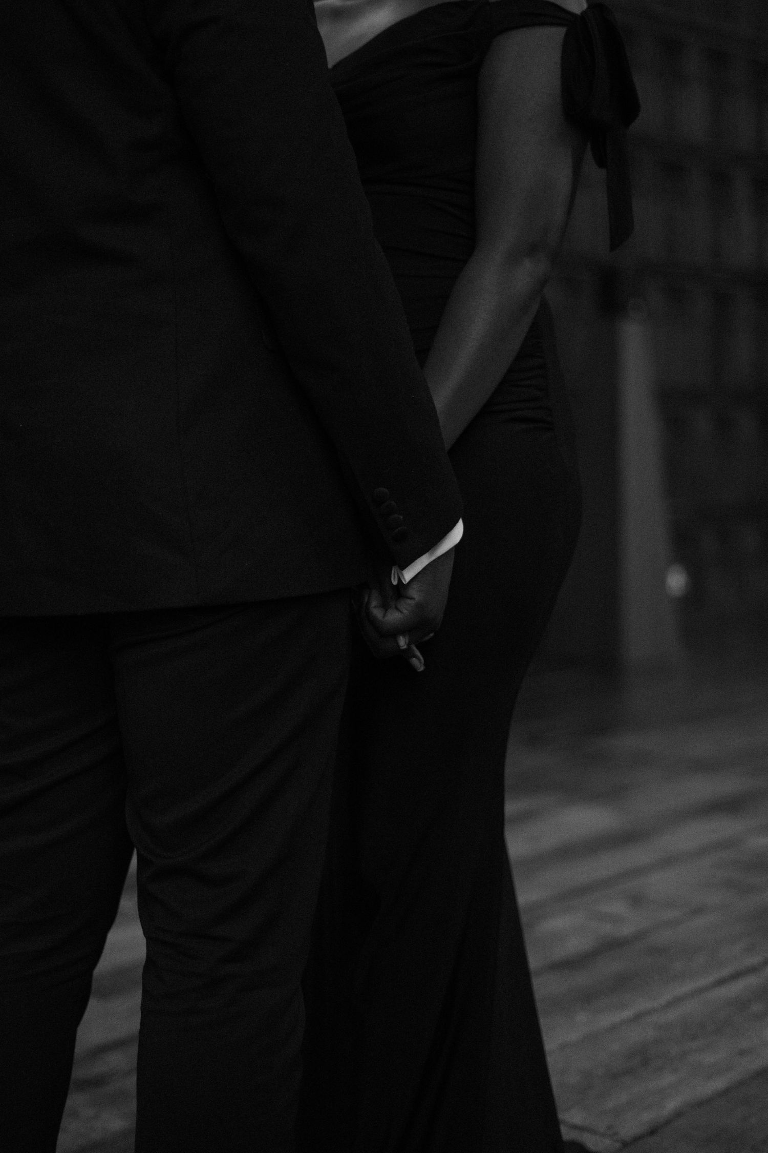 Intimate black and white dance sequence showing couples in formal wear.