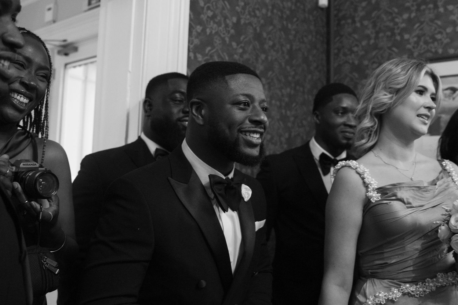 Wedding guests enjoy themselves during a formal reception celebration.