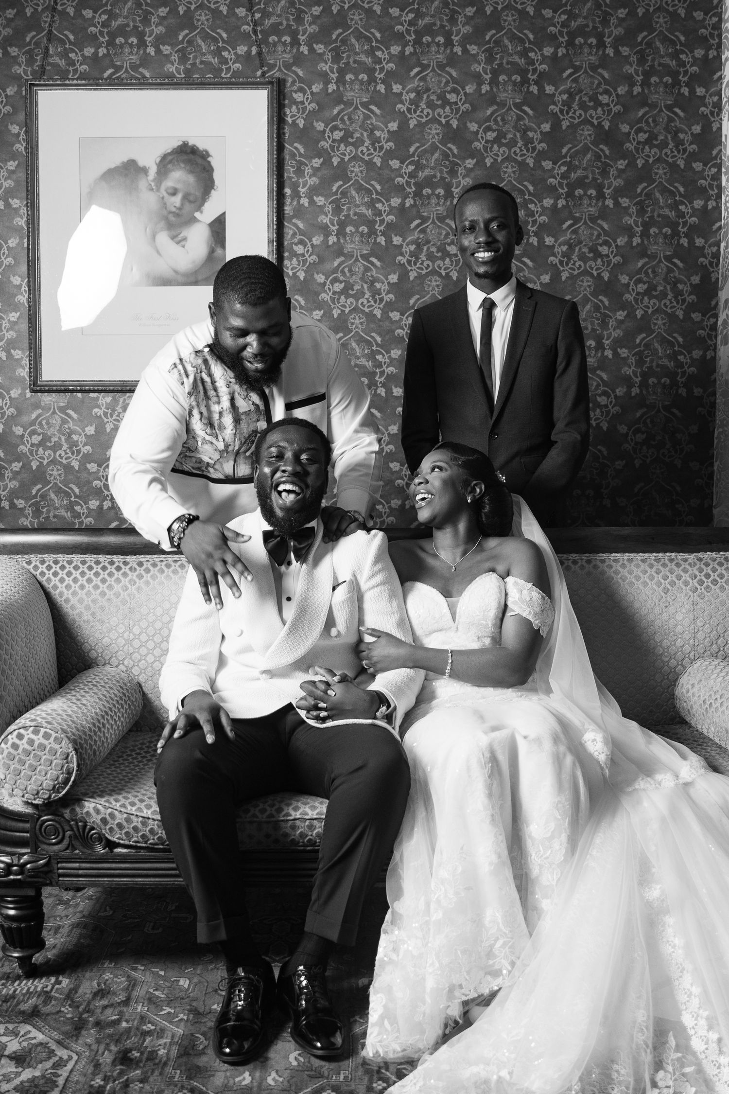 Black and white photo series of wedding couple sharing intimate moments on vintage couch.