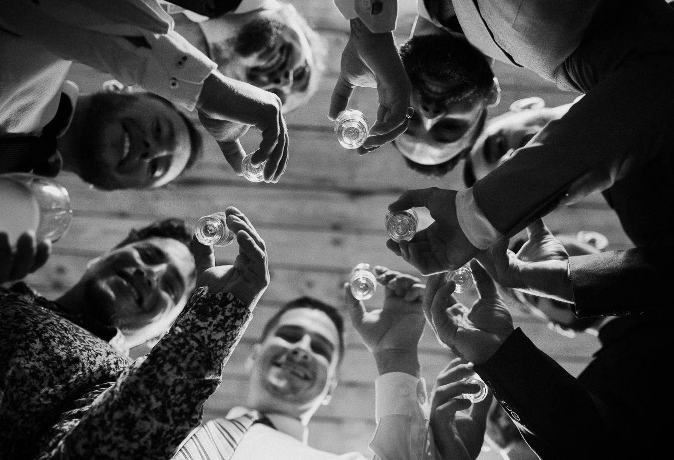 Black and white photos show hands reaching up towards a basketball during an intense game moment.