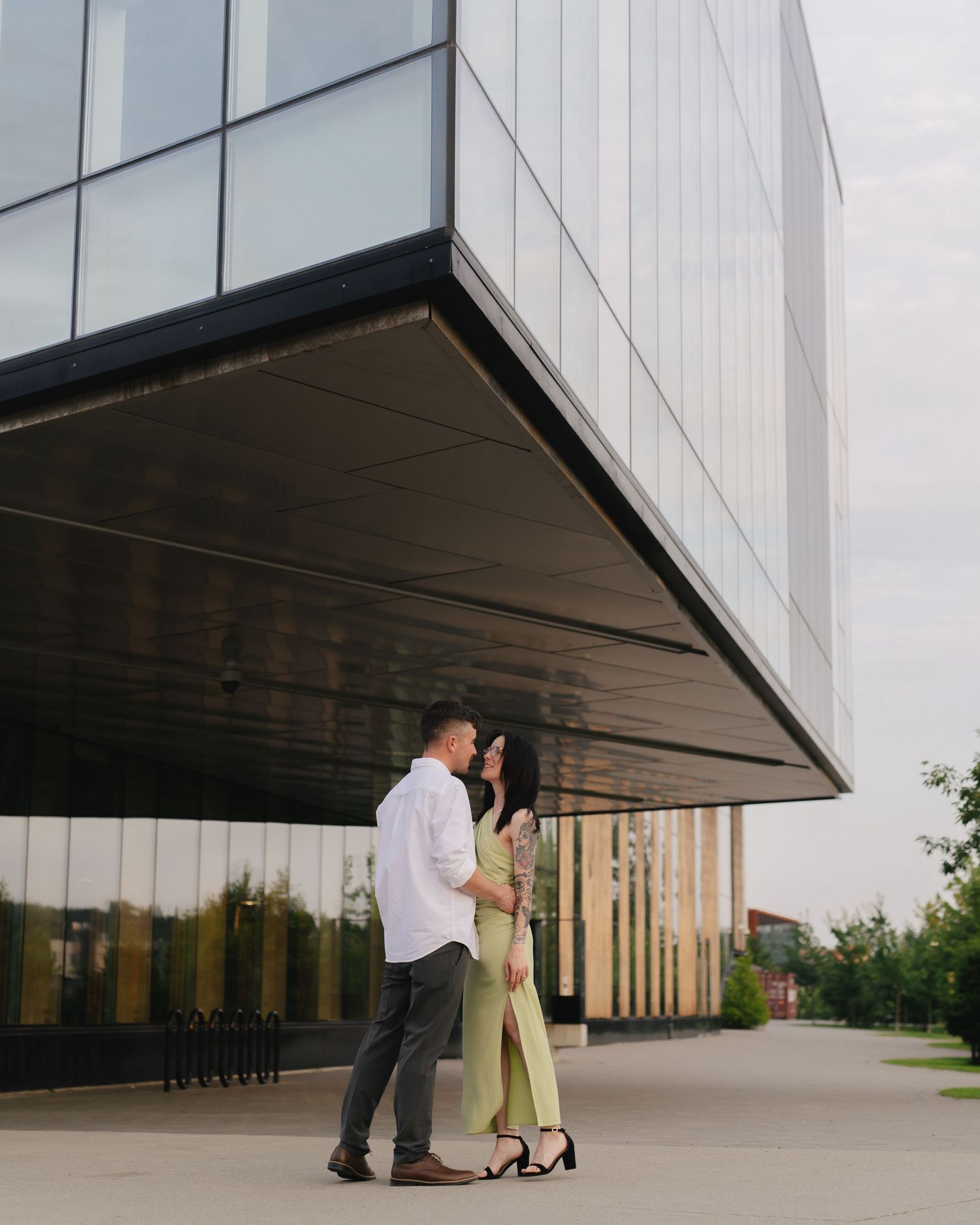 A couple shares an intimate moment under a University McEwen School of Architecture downtown Sudbury