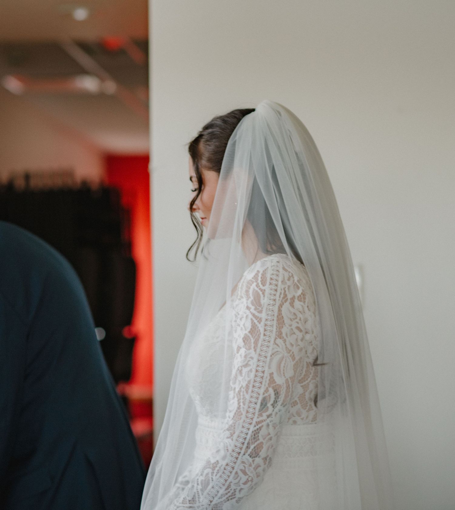 A bride in a white lace wedding dress and veil is shown in a series of close-up photos from different angles.