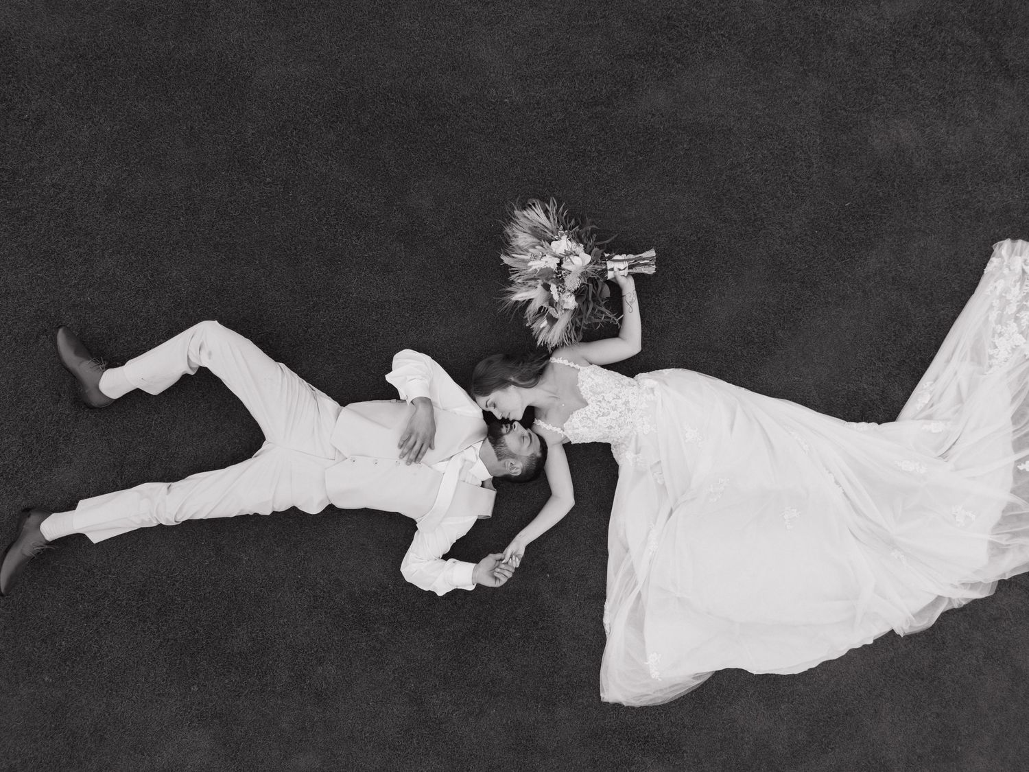 Artistic black and white dance poses against a dark background.