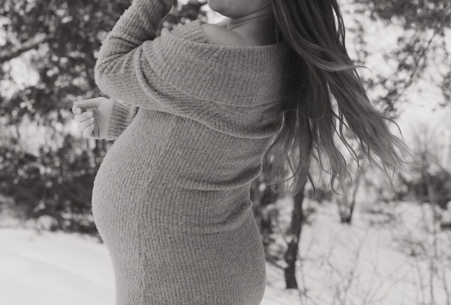 Close-up shots of a beige knit maternity dress in a winter setting.