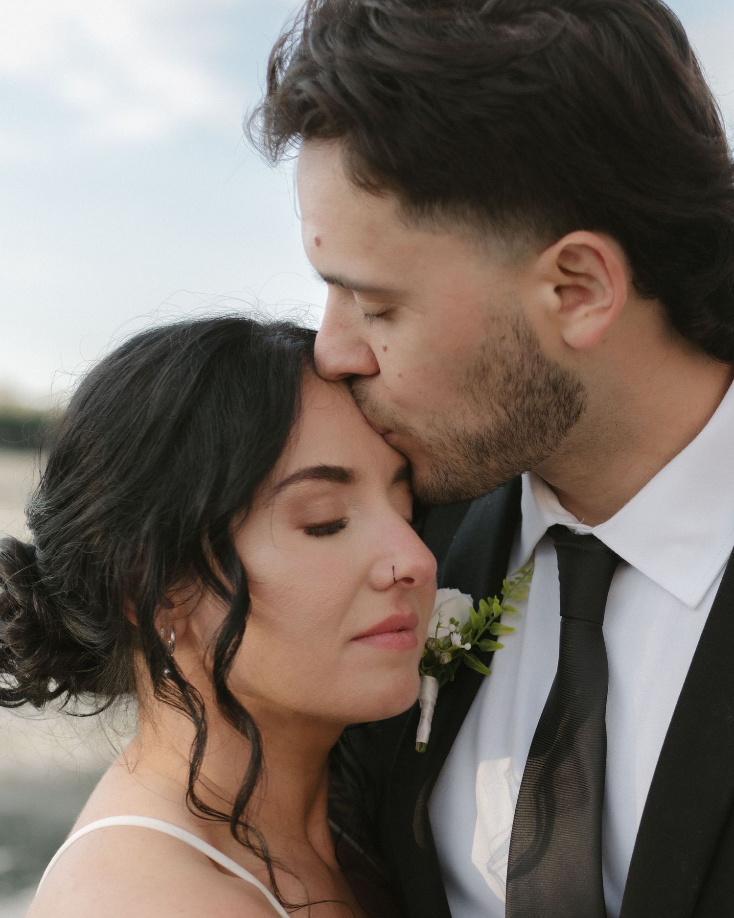 Intimate wedding portrait series showing tender moments between newlyweds.