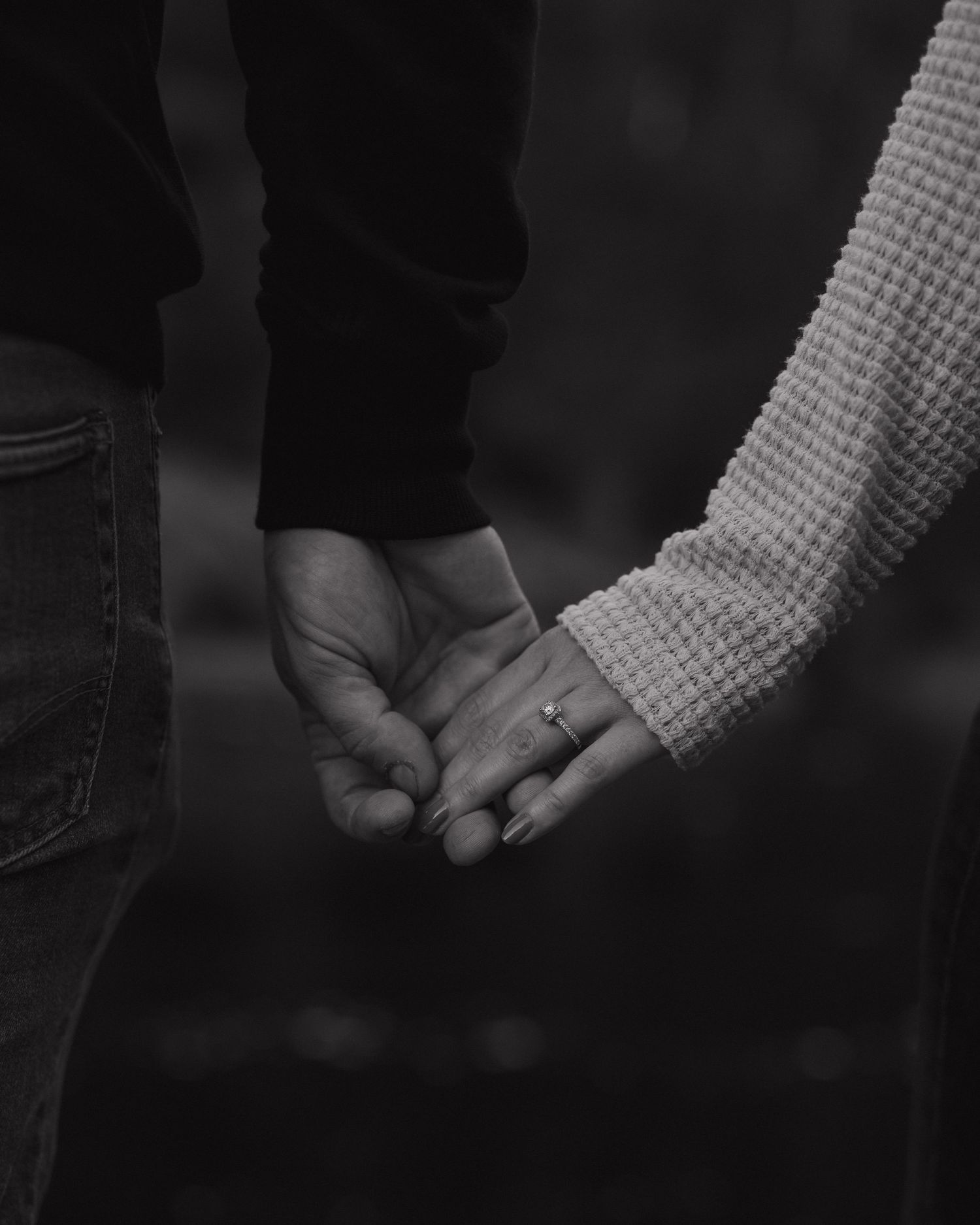 Black and white photo series showing two hands clasped together in different intimate poses.