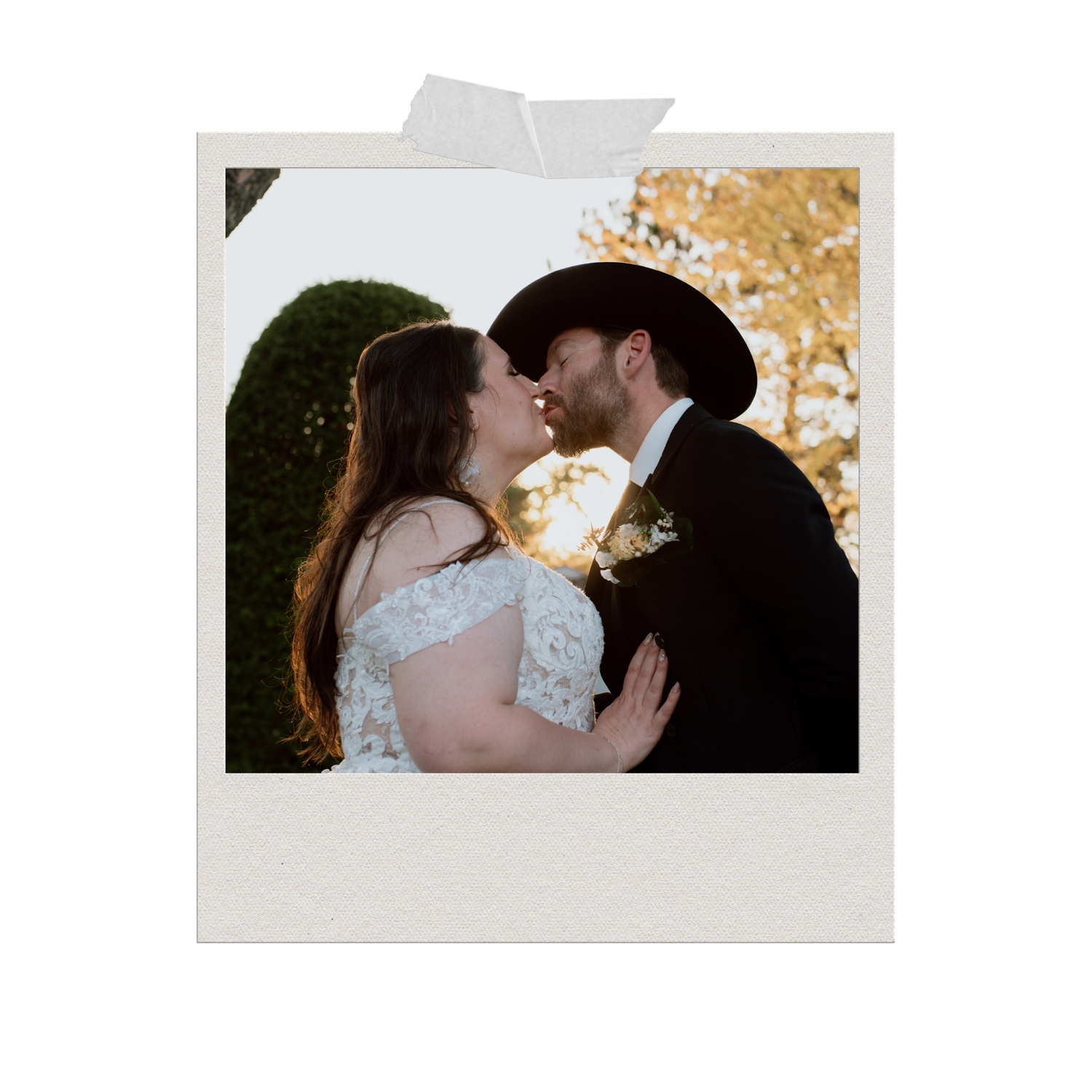 A bride and groom share a romantic kiss in a polaroid-style photo, with the groom wearing a black cowboy hat.