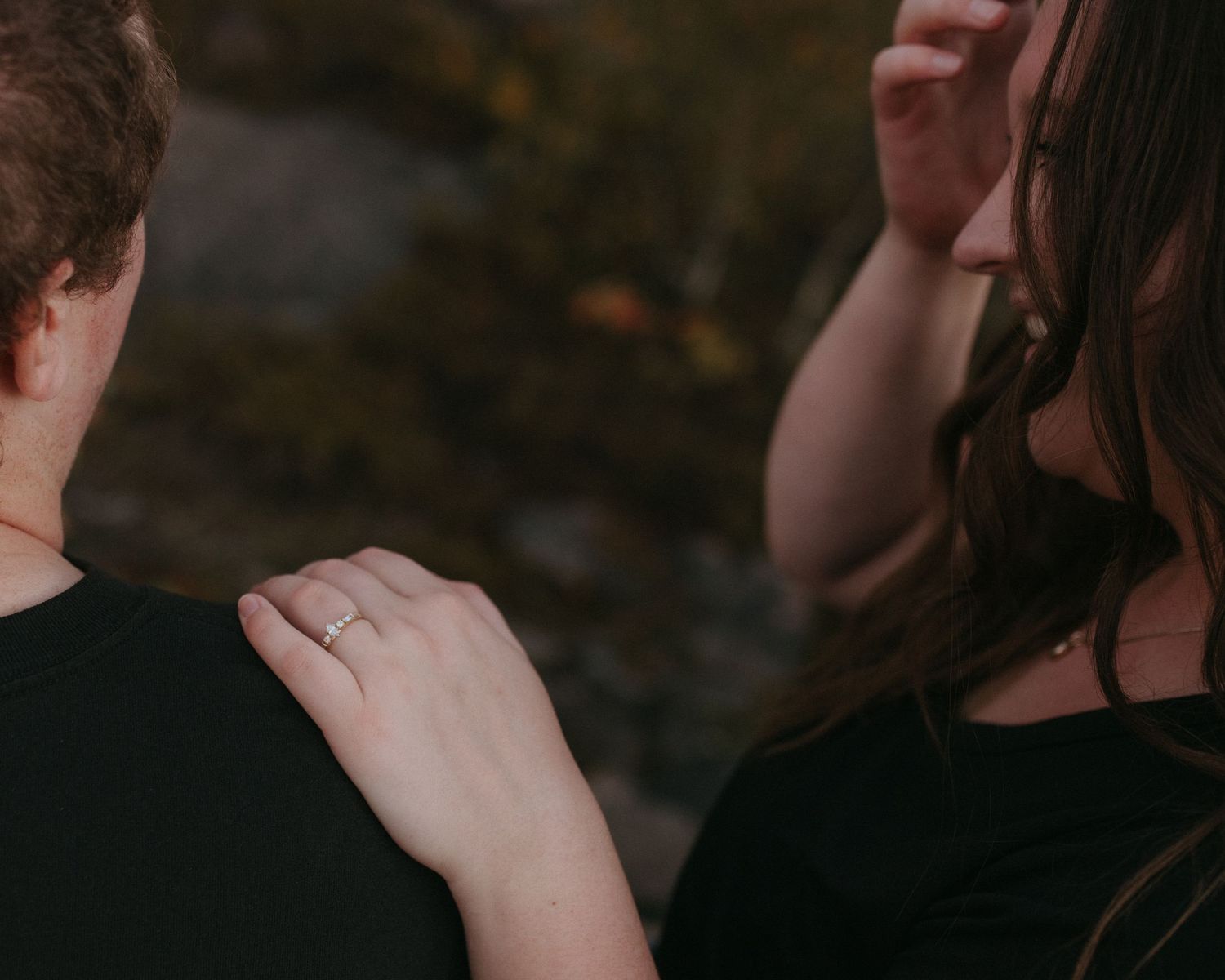 Close-up shot of hands touching in an intimate moment.