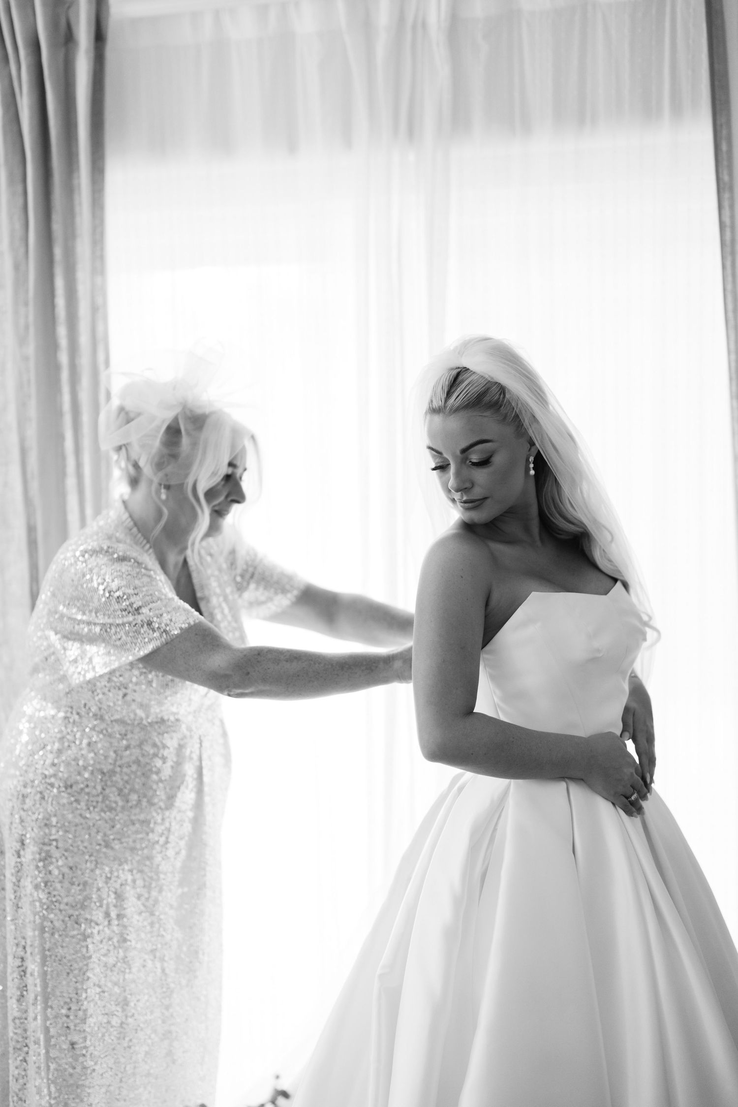 Series of elegant bridal preparation moments showing details of a white wedding gown.