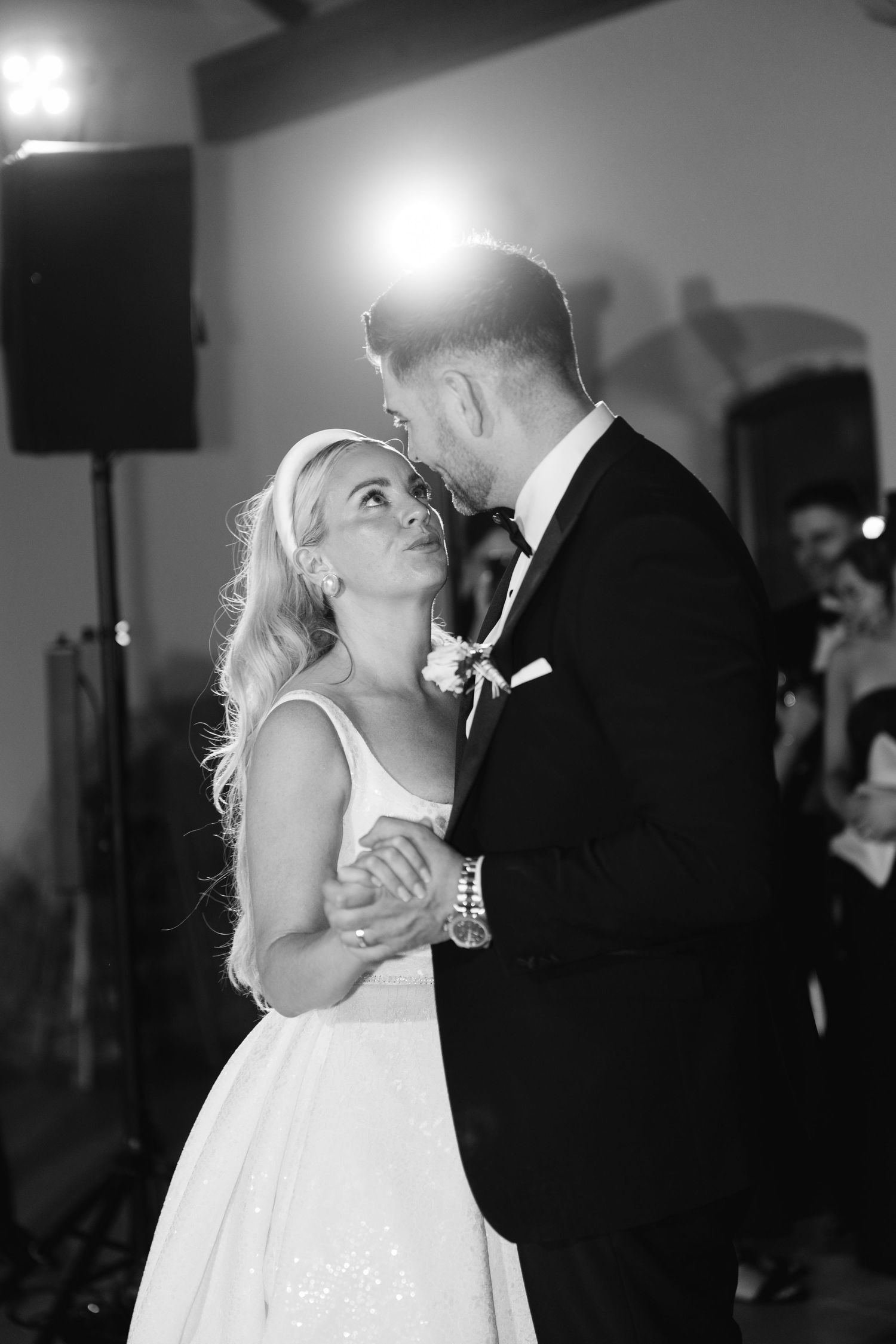 Intimate black and white dance photo at wedding reception.