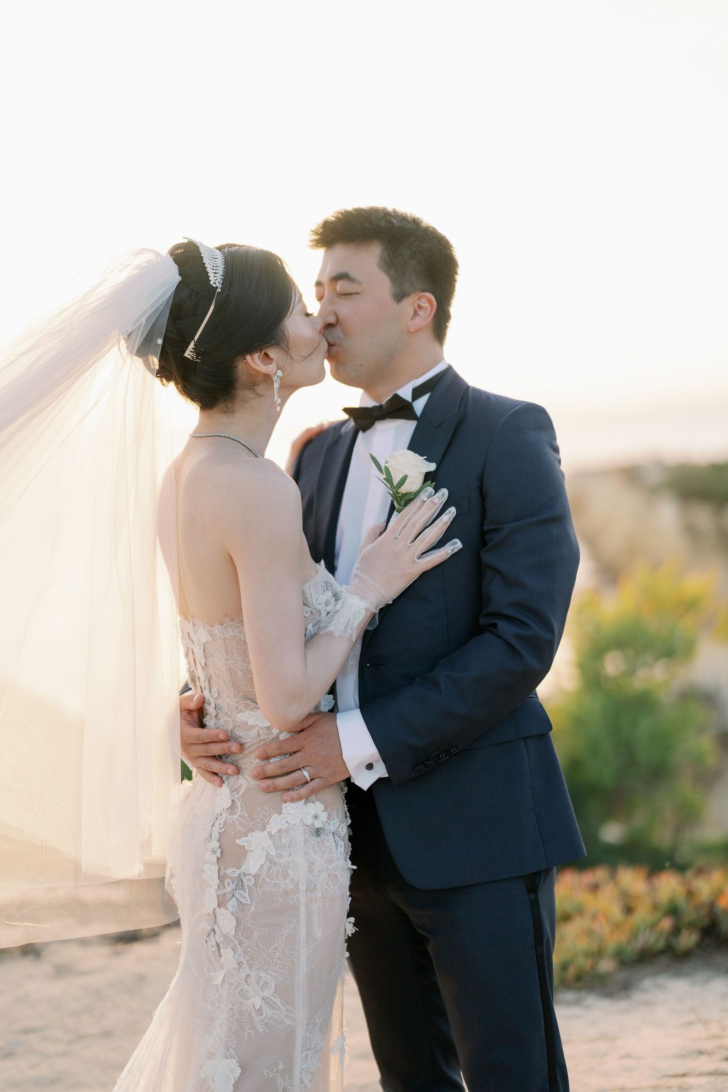 Wedding couple sharing tender moments during golden hour photo session.