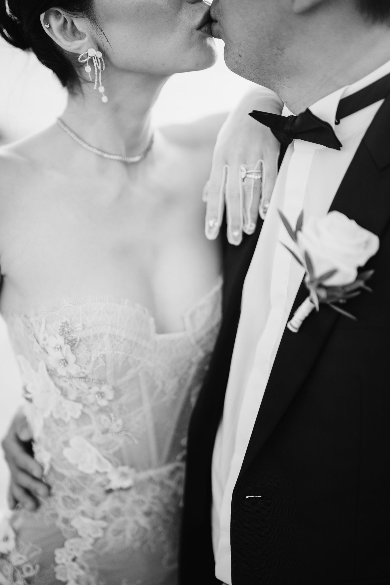 Intimate black and white wedding portraits showing romantic moments between newlyweds.