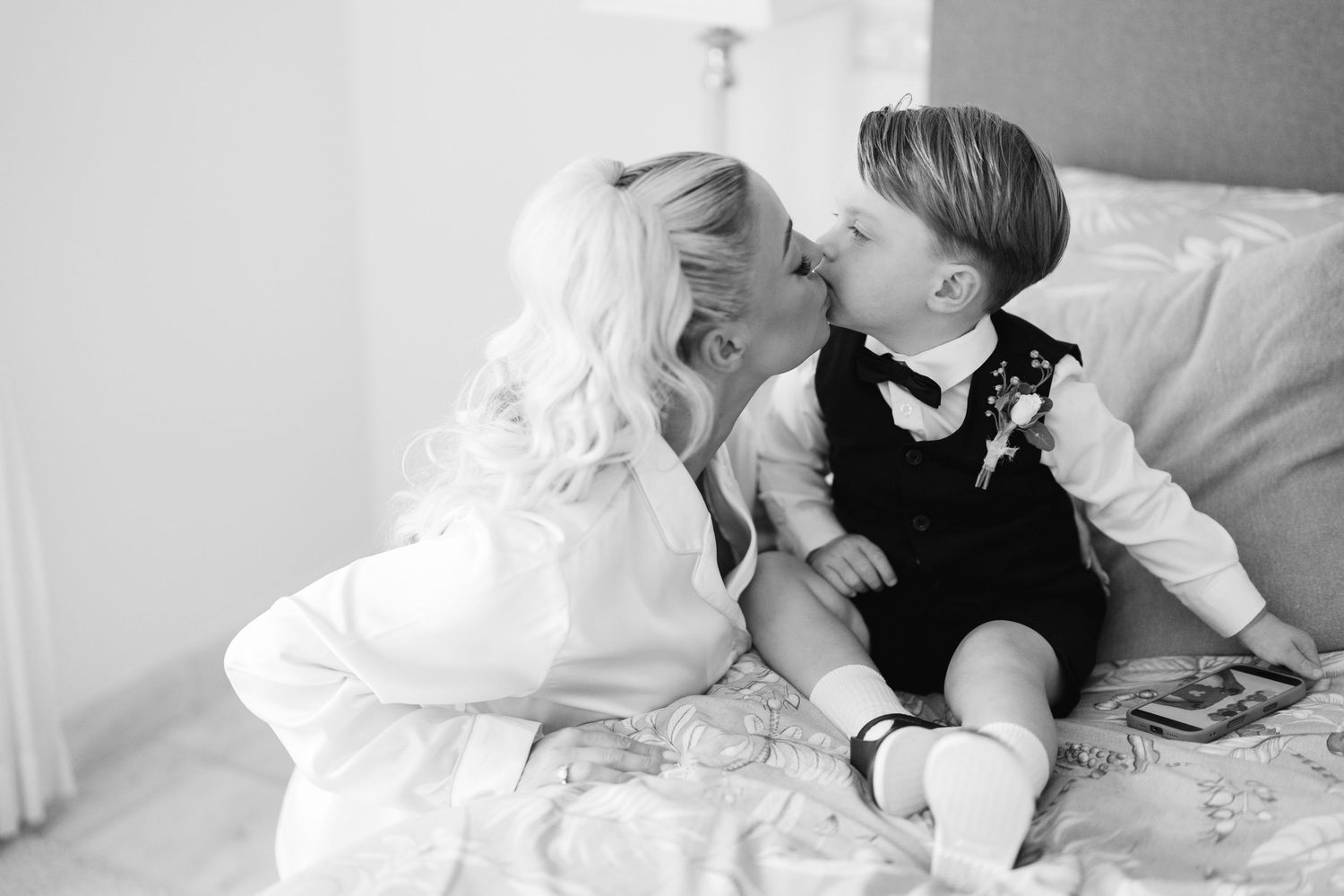 Wedding couple sharing intimate moments in black and white photography.