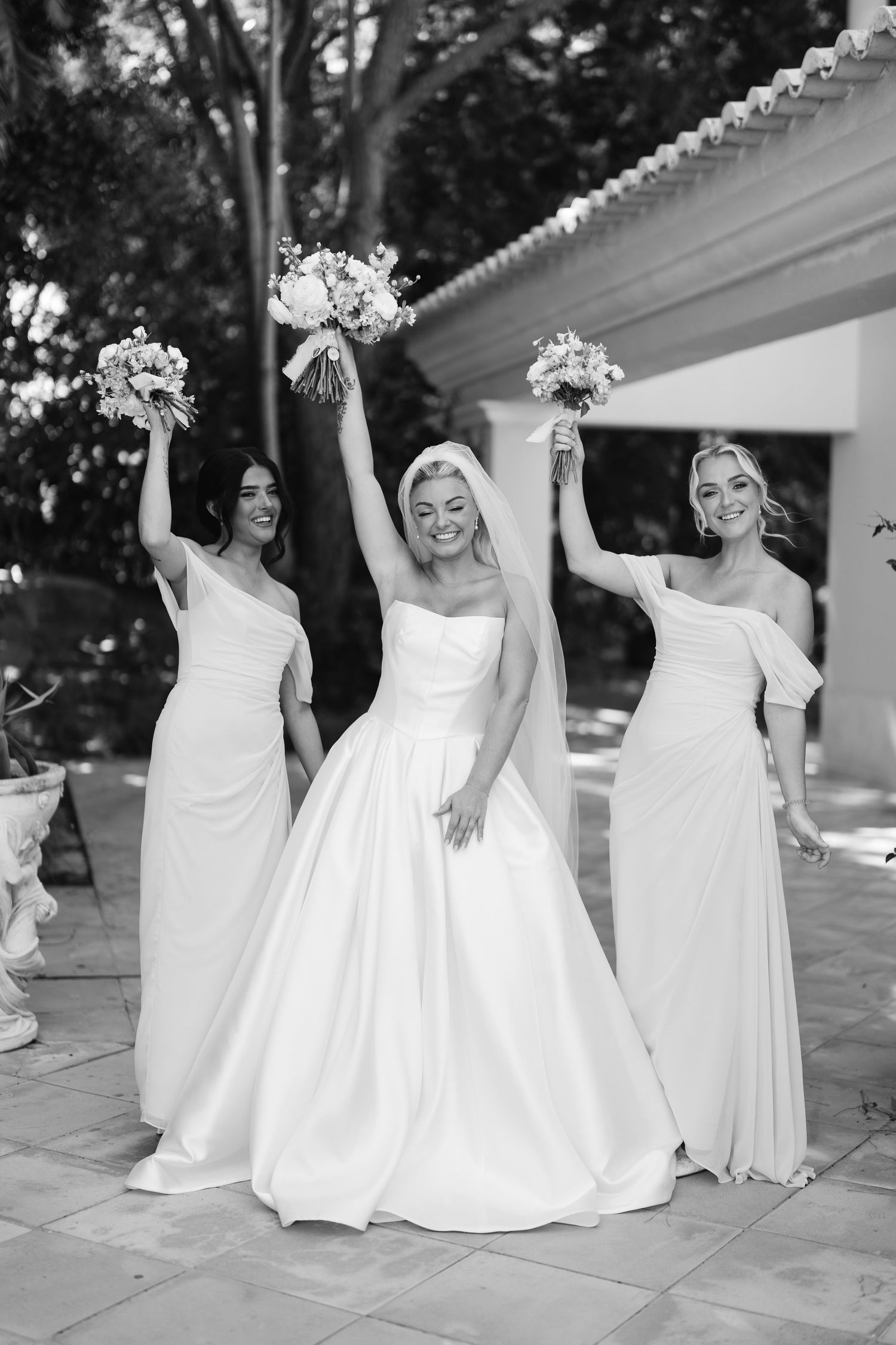 Wedding party in white dresses laughing and posing together in a joyful outdoor photo sequence.