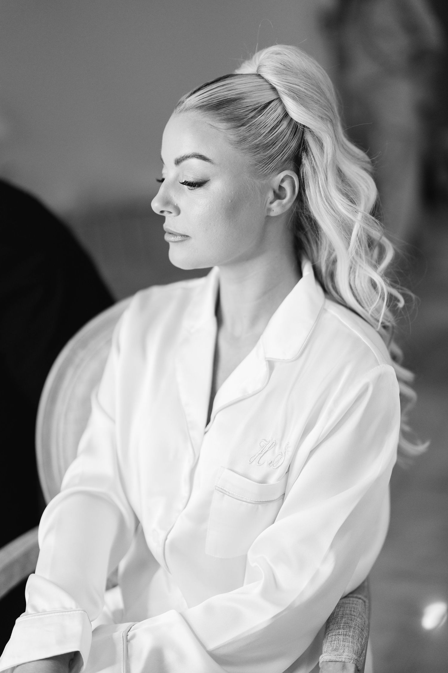 Black and white portraits showcase elegant bridal preparation moments.