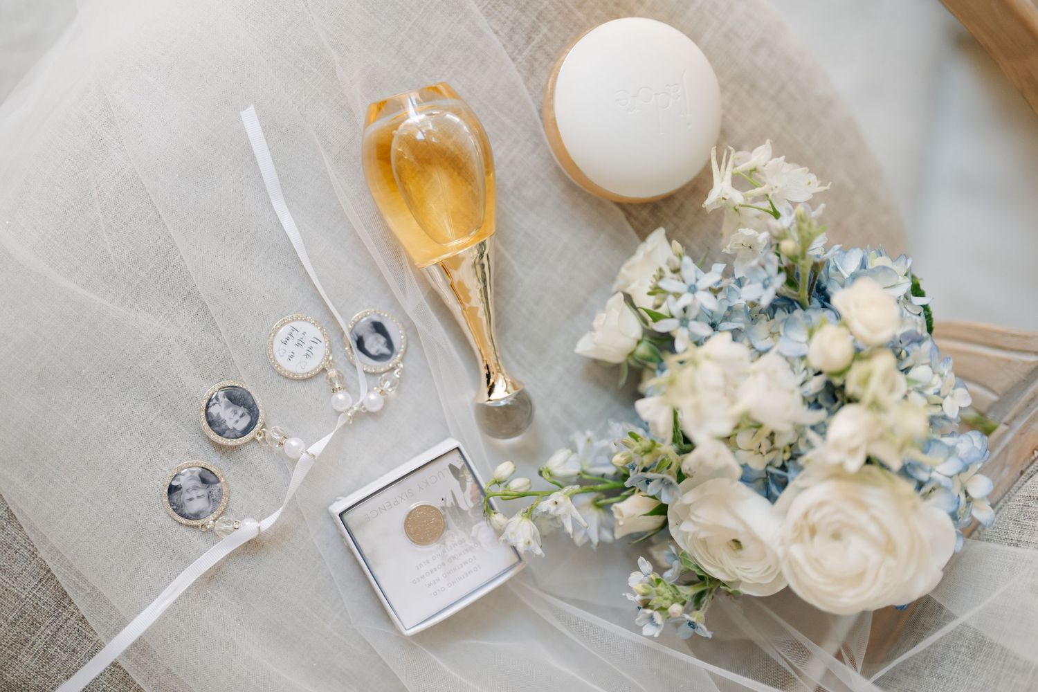 Elegant wedding table setting with white flowers and glassware.