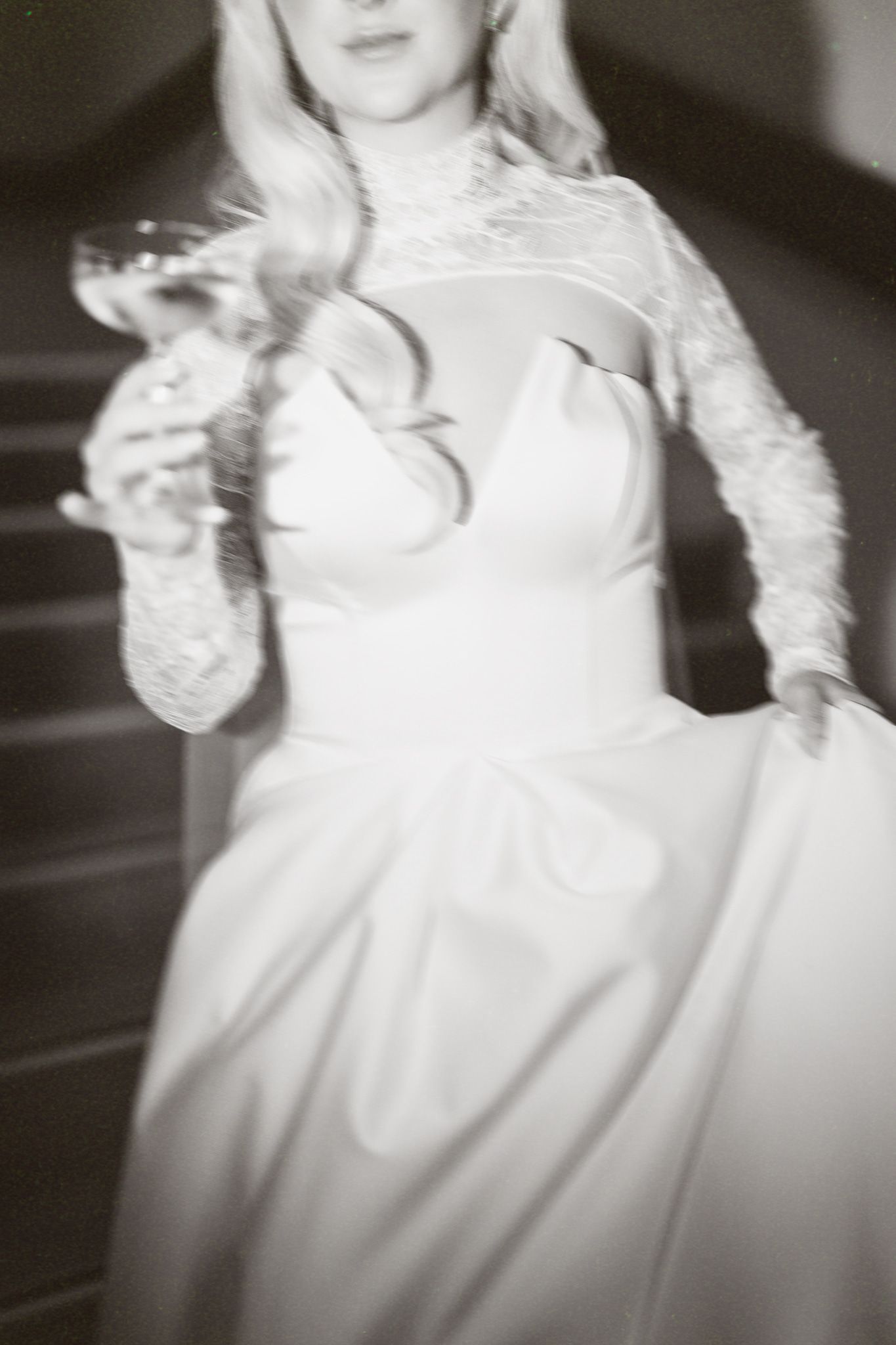Artistic black and white close-ups of a wedding dress with lace details.