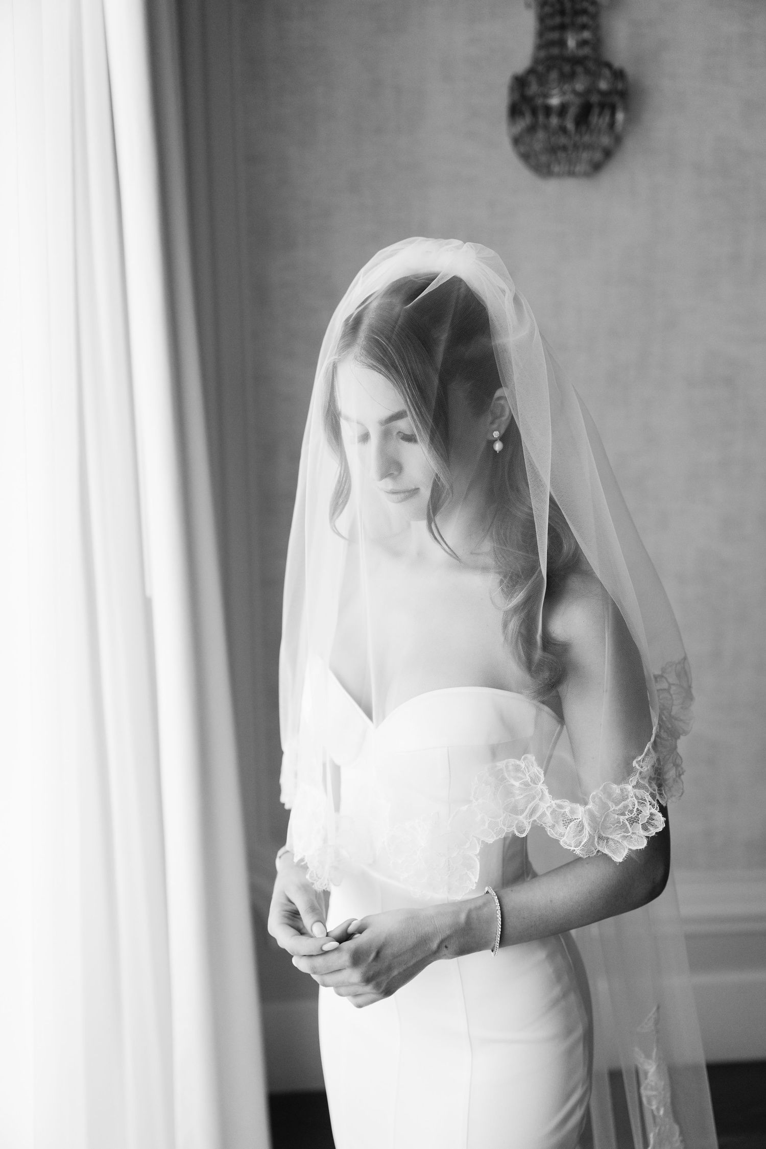 Classic bridal portrait in black and white with delicate veil.