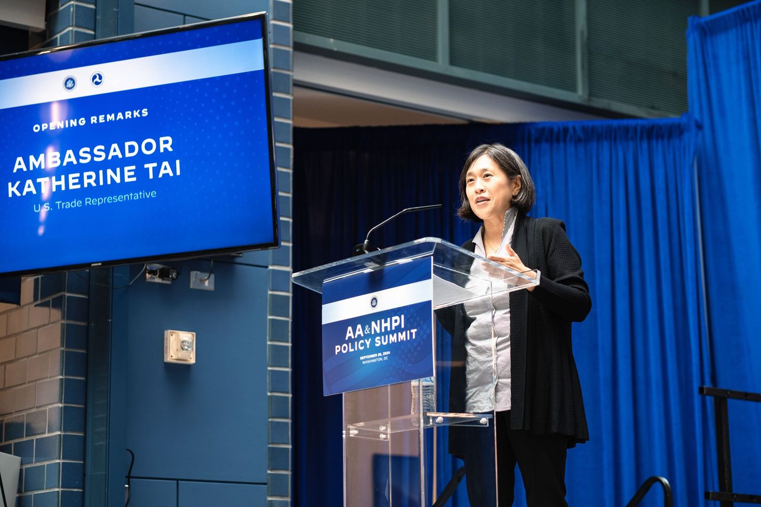Ambassador Katherine Tai delivers opening remarks at the AA & NHPI Policy Summit at a podium.