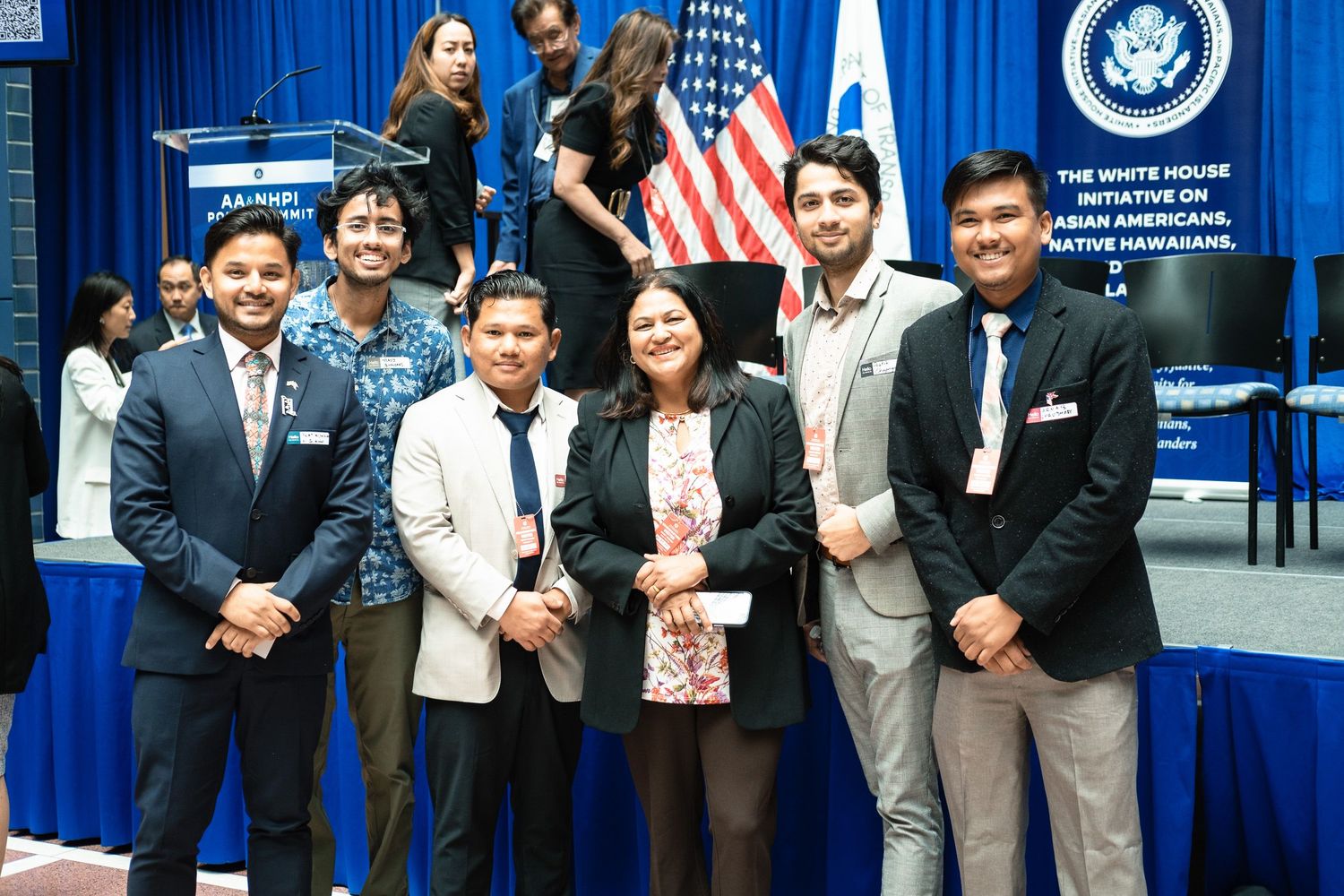 Five individuals smile together at a White House Initiative on Asian Americans official event.