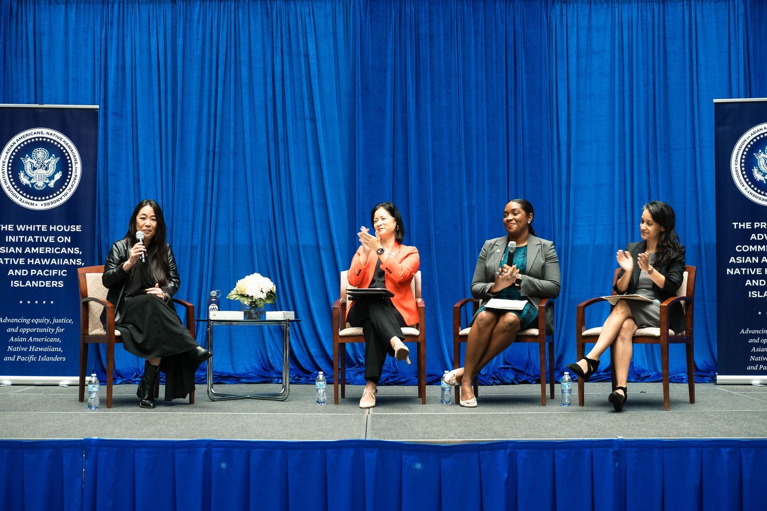 Four women speak on a panel at a White House Initiative on Asian Americans and Pacific Islanders event.