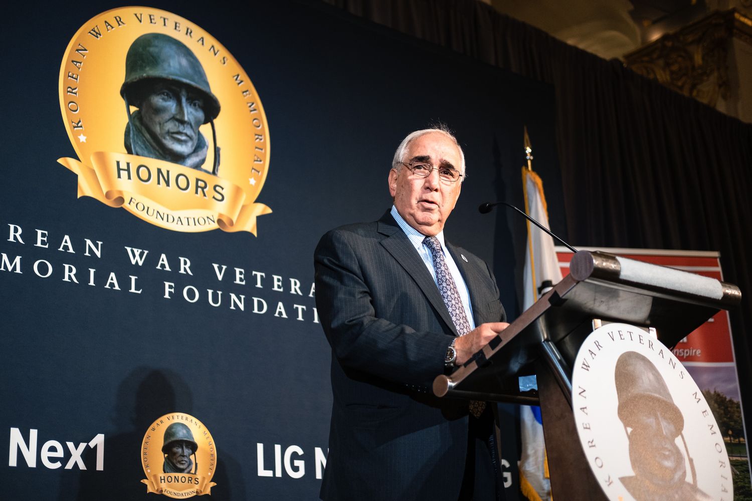 Distinguished speaker presents at Korean War Veterans Memorial Foundation Honors ceremony at formal gala.