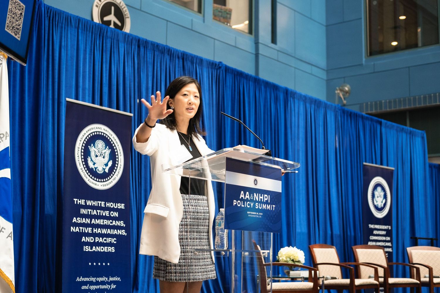 Woman speaking at podium during White House Initiative on Asian Americans, Native Hawaiians, and Pacific Islanders Policy Summit.